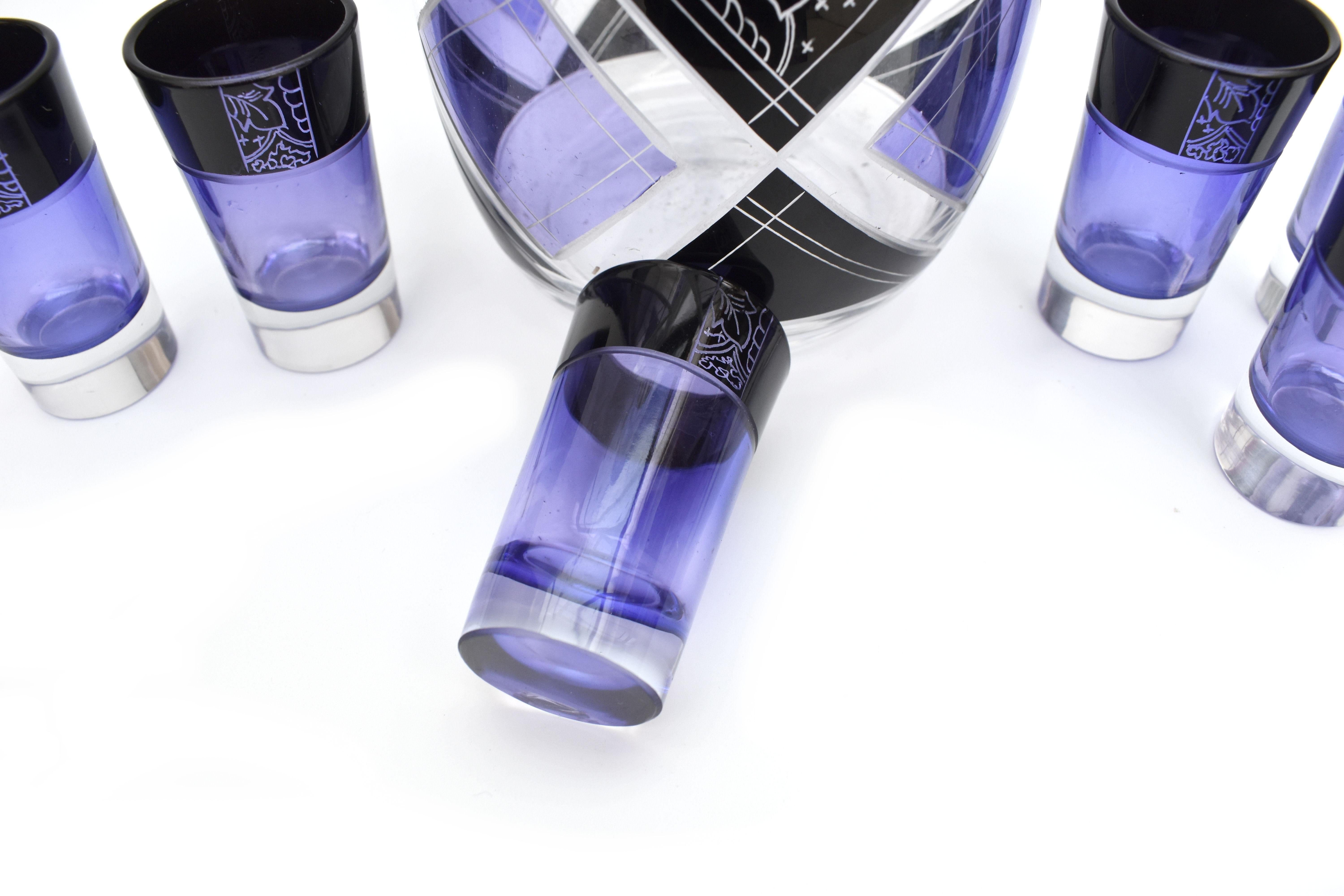 Very high quality, very striking looking 1930's Art Deco Czech glass decanter set. Features a classic shape crystal decanter with stopper and six decent sized glass tumblers . The whole set is enamelled in purple and black with etching to highlight