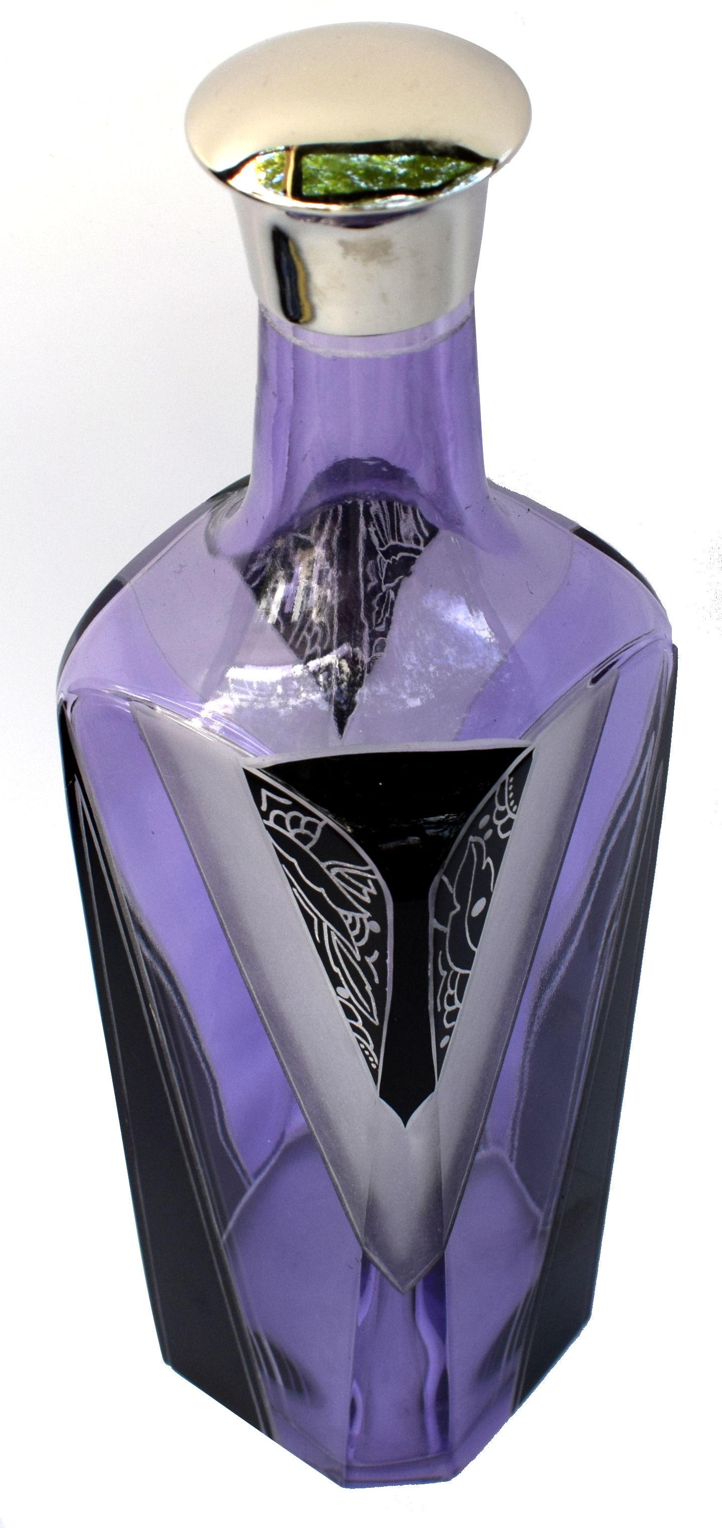 Very high quality and beautifully crafted collectable Art Deco glass liquor decanter set by Karl Palda. Featuring mauve coloured glass which is the back drop to black enamel decoration and etching accents. These Classic sets are rare and a beautiful