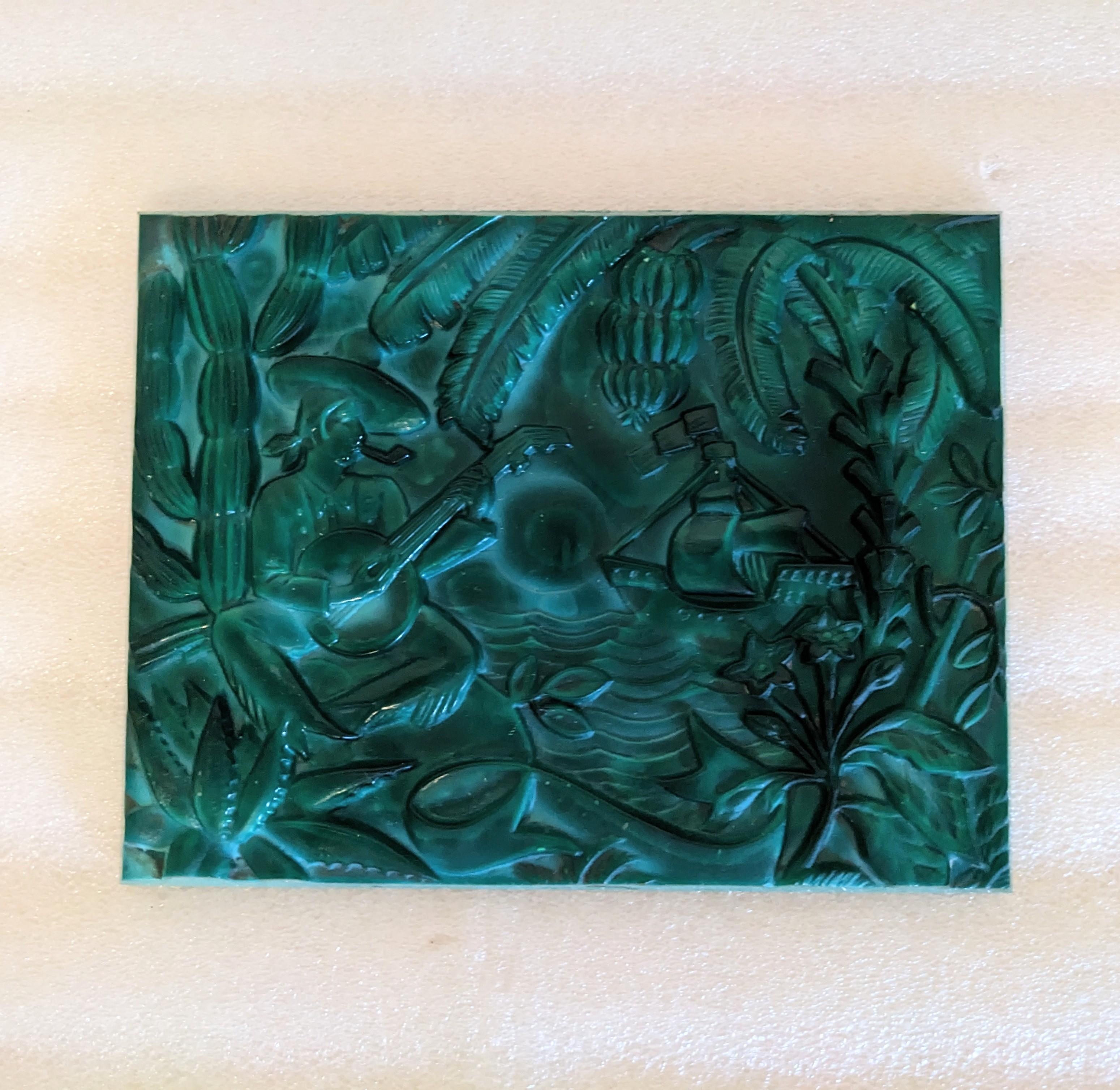 Art Deco Czech Malachite Glass Molded Panel from the 1930's. Depicting a musician playing in a tropical scene by the sea. 6.5