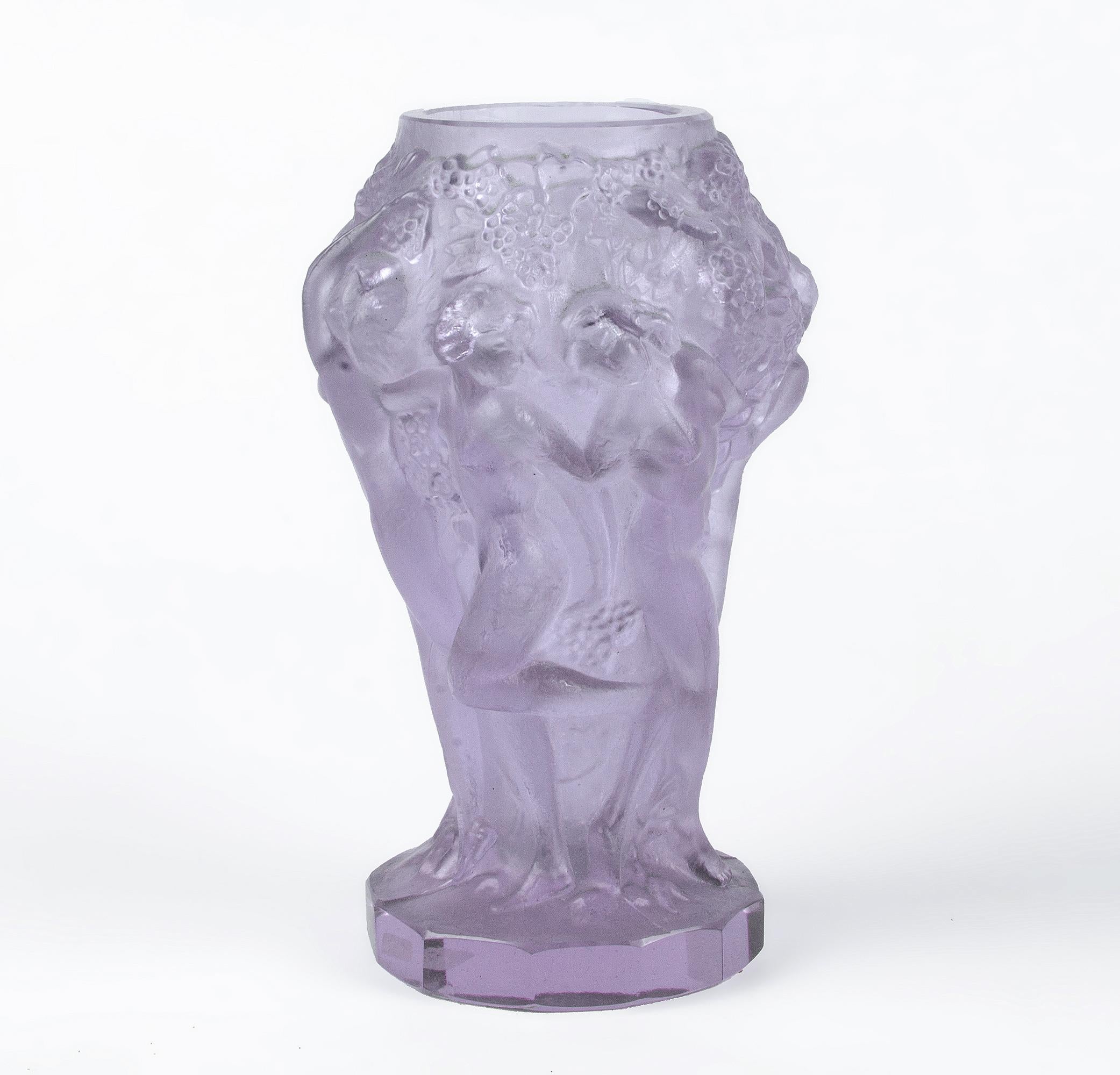 Art Déco czech translucent pinkish art glass small vase decorated with nude figures from the 'Ingrid' collection by Curt Schlevogt

By: Curt Schlevogt
Material: art glass, glass
Technique: molded, polished
Dimensions: 4 in x 5 in
Date: early 20th