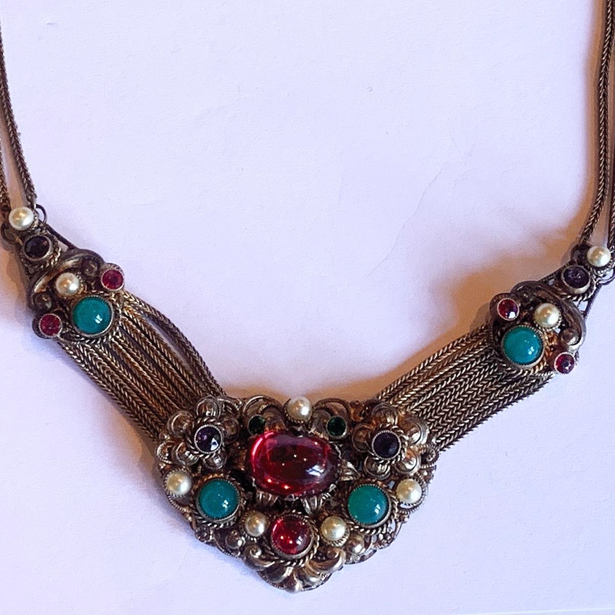 An original Art Deco Czechoslovakian “Tutti Frutti” Glass Necklace, intricate gilded design, and Hallmarked “Czechoslovakia” to rear of main pendant. Excellent decoration incorporating small “pearls” as highlights and multi fine chains linking