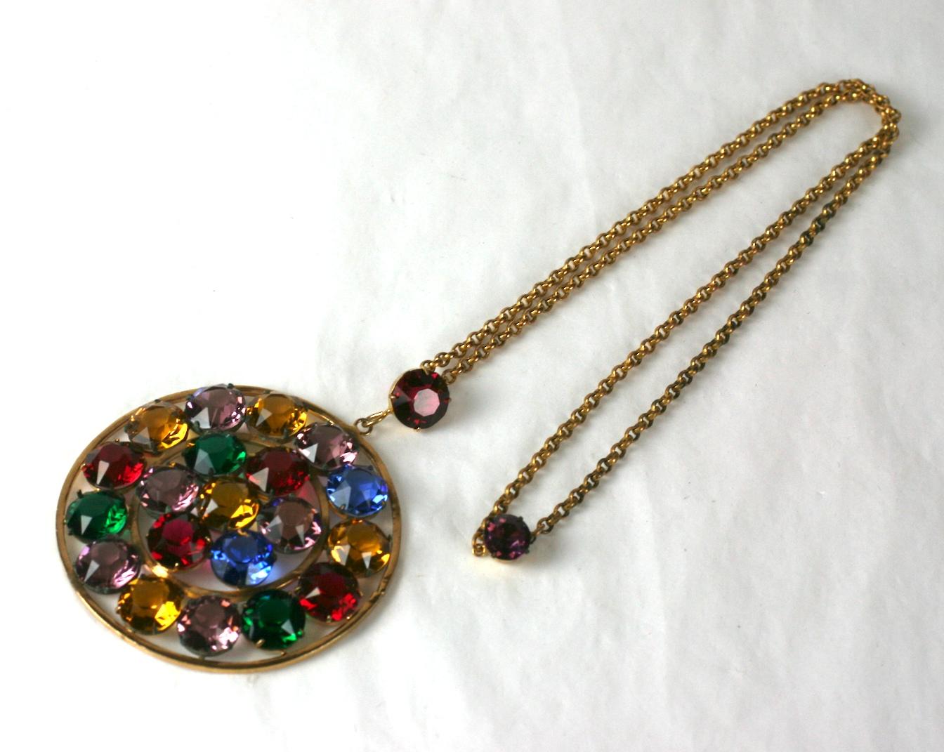 Large Czechoslovakian Art Deco pendant necklace of faux gem stone colored glass crystals. Prong set round pendant and bale in gilt metal with rolo chain.
Excellent Condition. 
Length 21