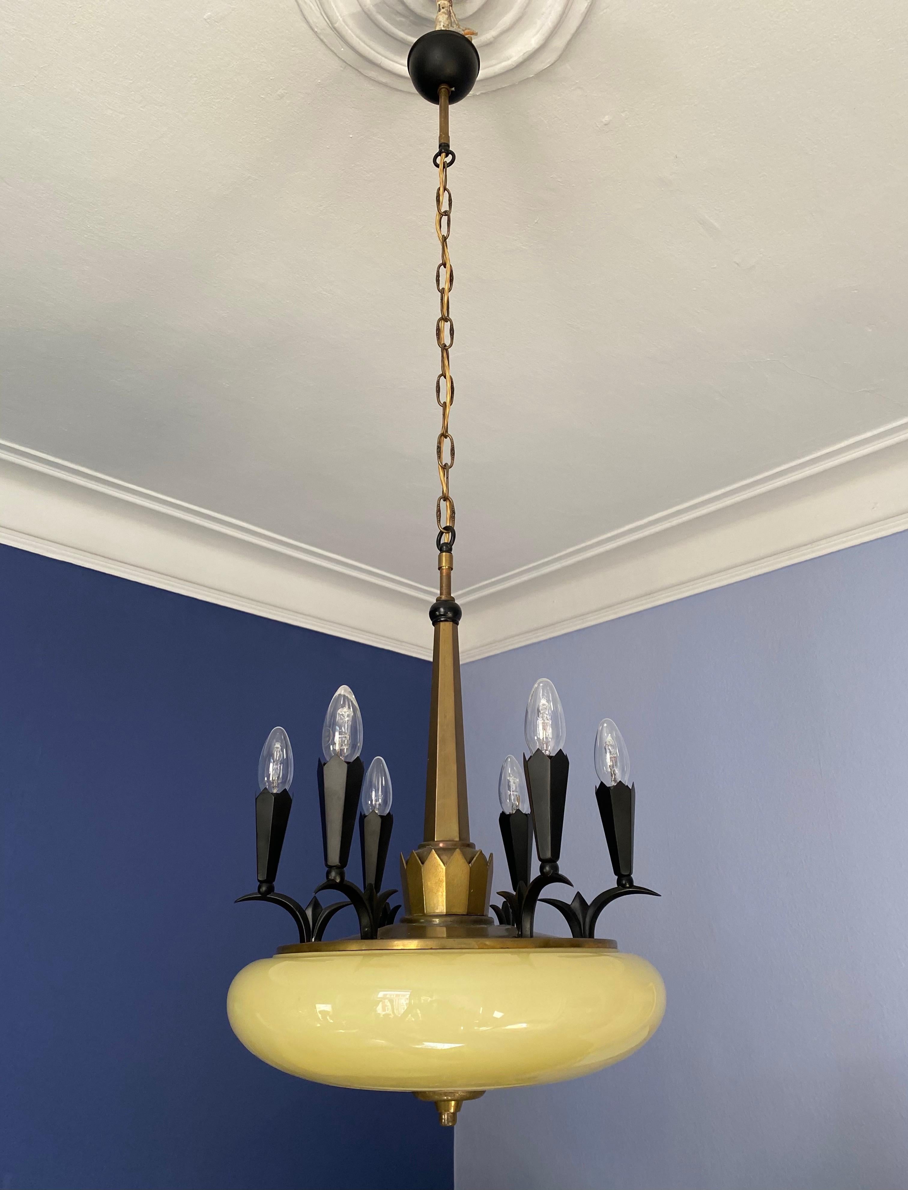 A rare and unusual Art Deco Chandelier, Vienna Secession, in solid brass with elements reminding on a crown and hand blown glas attributed to Dagobert Peche, Wiener Werkstätten.

 The length is adjustable depending on maybe shorten the chain.