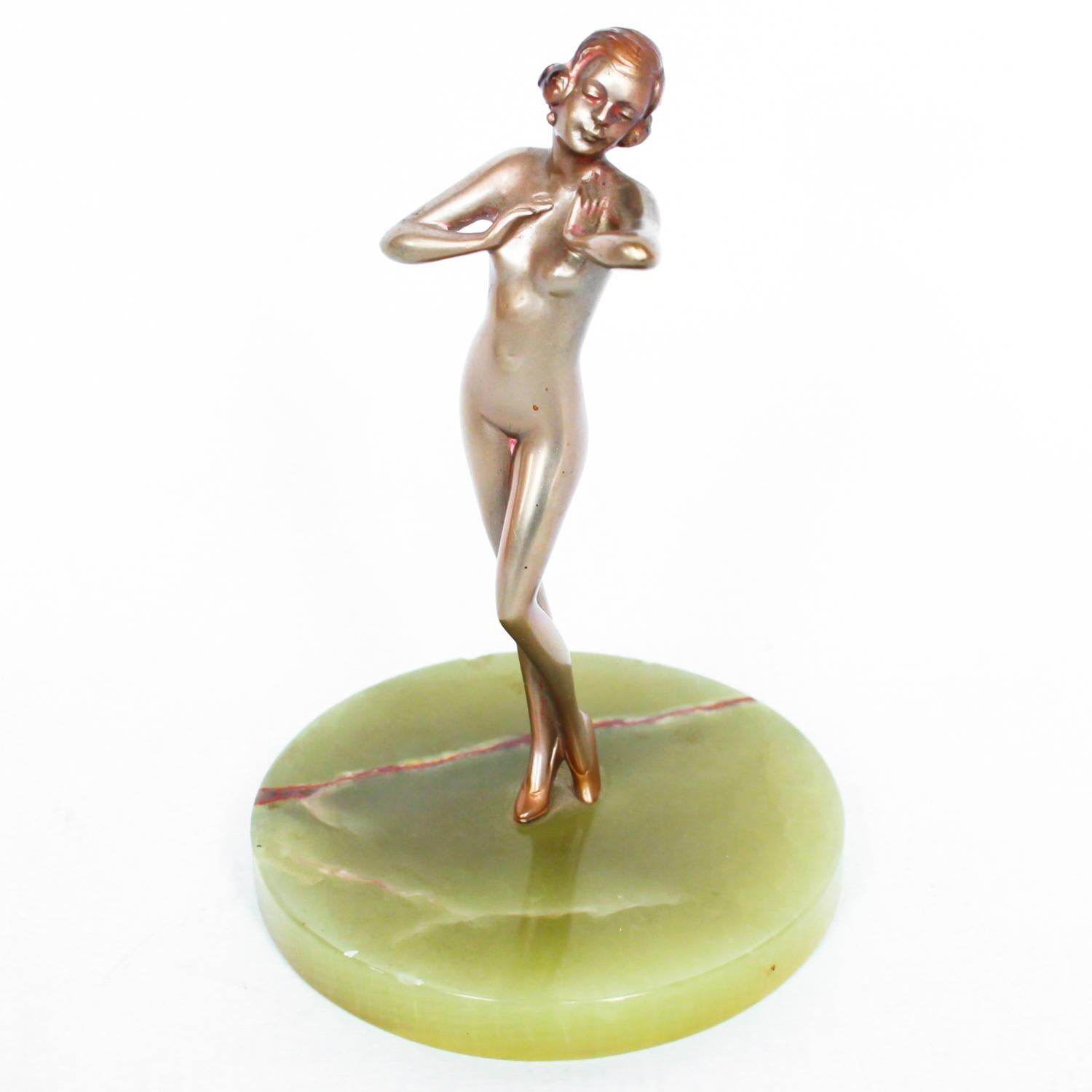 An Art Deco, cold painted bronze figure of an elegant dancer in a striking pose, raised on a green onyx base.

Attributed to Lorenzl.

Dimensions: H 12 cm, W 8 cm, D 8 cm

Origin: Austrian

Date: circa 1930

Item No: 0710191.

  