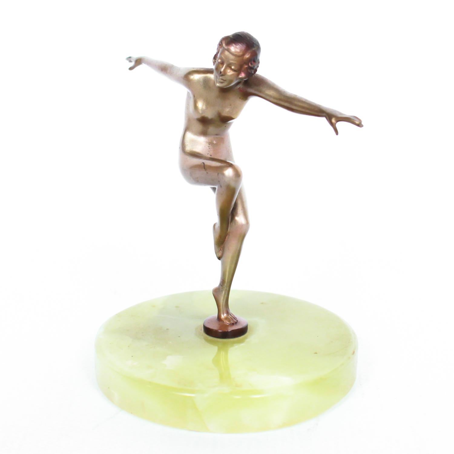 An Art Deco, cold painted bronze figure of an elegant dancer in a striking pose, raised on a green onyx base.

Attributed to Lorenzl.

Dimensions: H 12cm W 10cm D 8cm

Origin: Austrian

Date: circa 1930

Item No: 0710192.