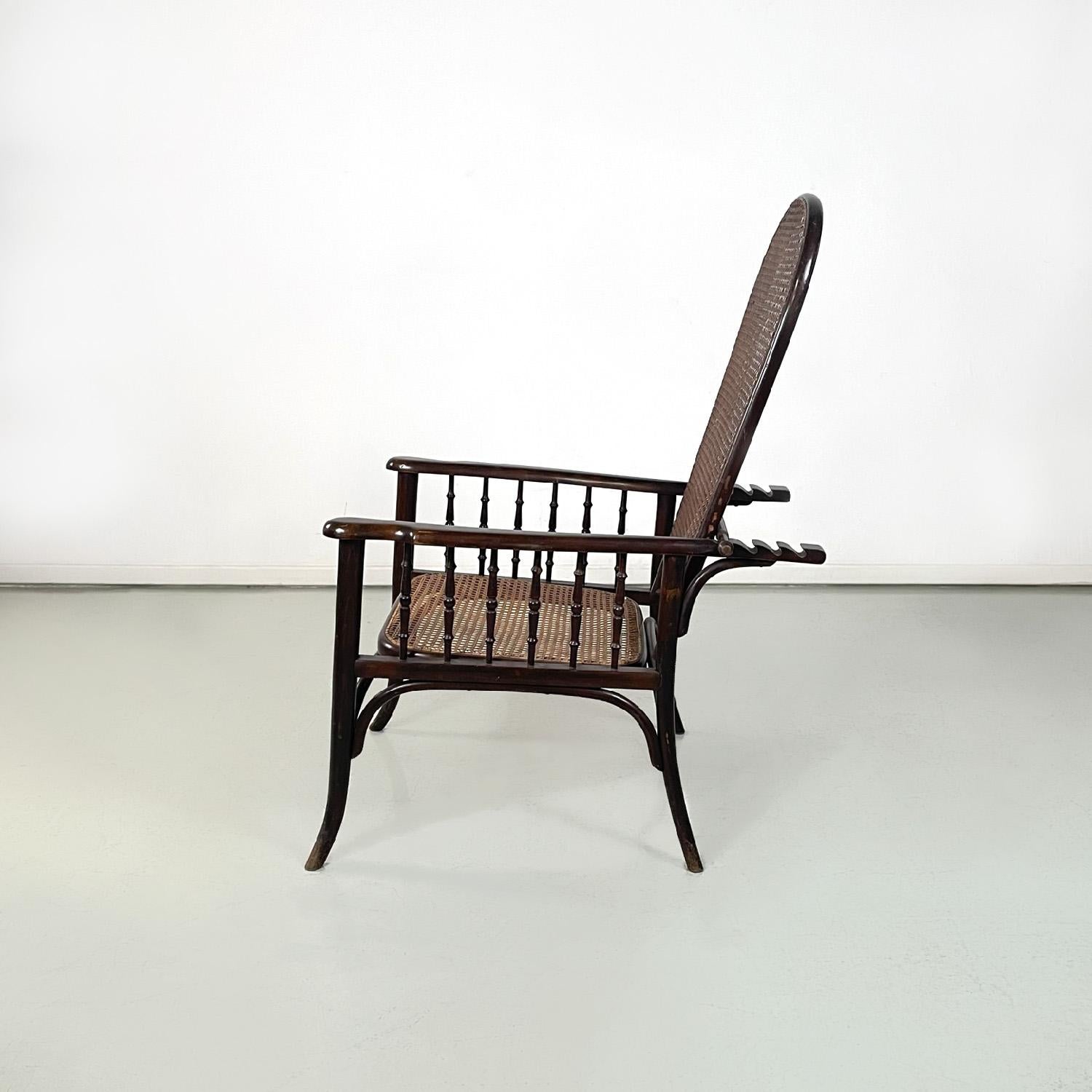 Art deco dark wood and straw armchair with reclining backrest, early 1900s
Wooden armchair. The backrest, in dark Vienna straw, is foldable and it is possible to change its inclination using a stick that moves and fits into various slots in the rear