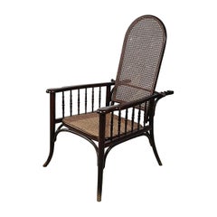 Fauteuil Art Déco en bois foncé et paille avec dossier inclinable, début des années 1900