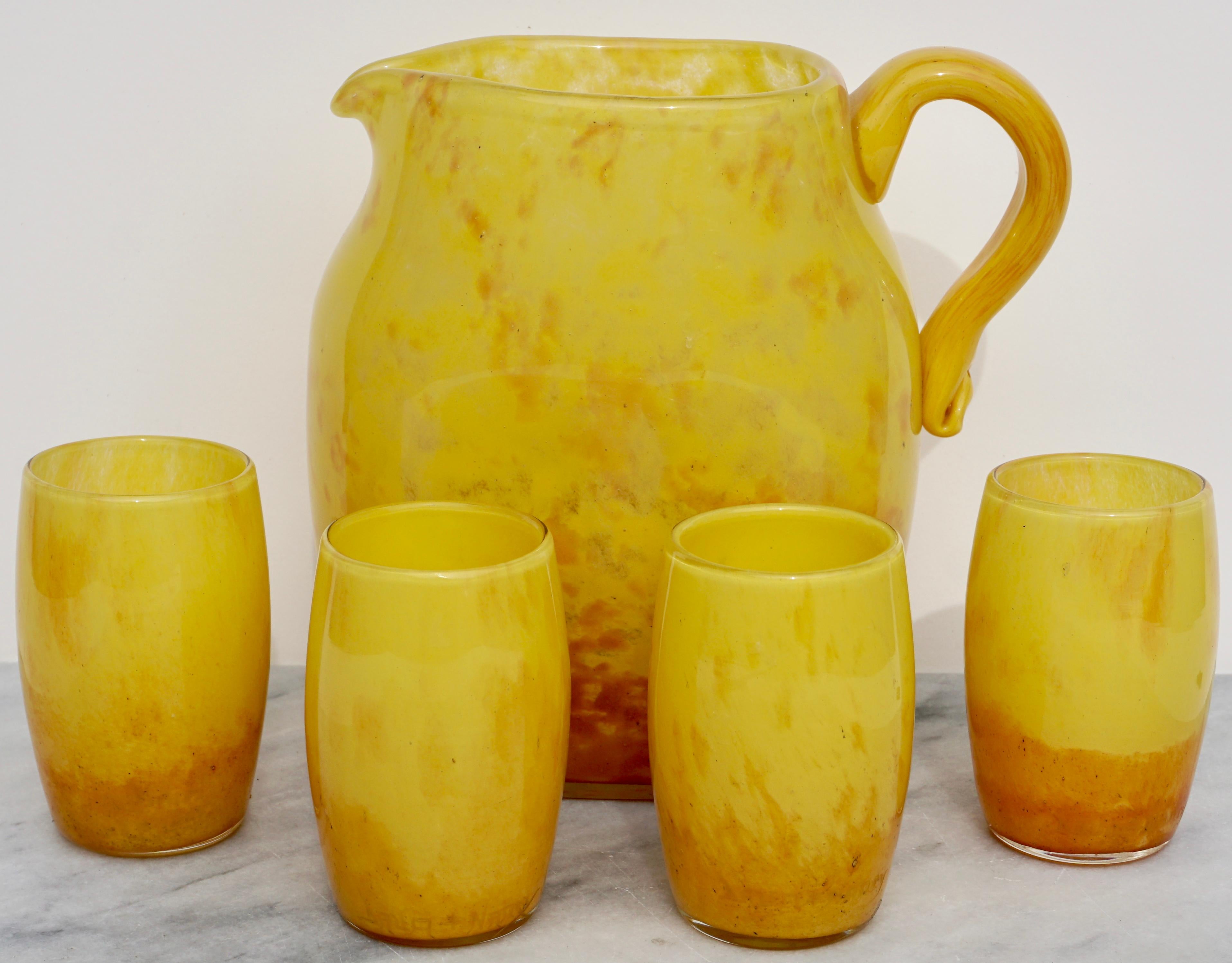 A sunshine yellow meets a sunset orange in this ombré variegated Daum Nancy glass Carafe et Verre ensemble. Anyone up for fresh lemonade or merry Sangria. Perfectly sized for a party of four; this one of a kind set has garnered positive responses