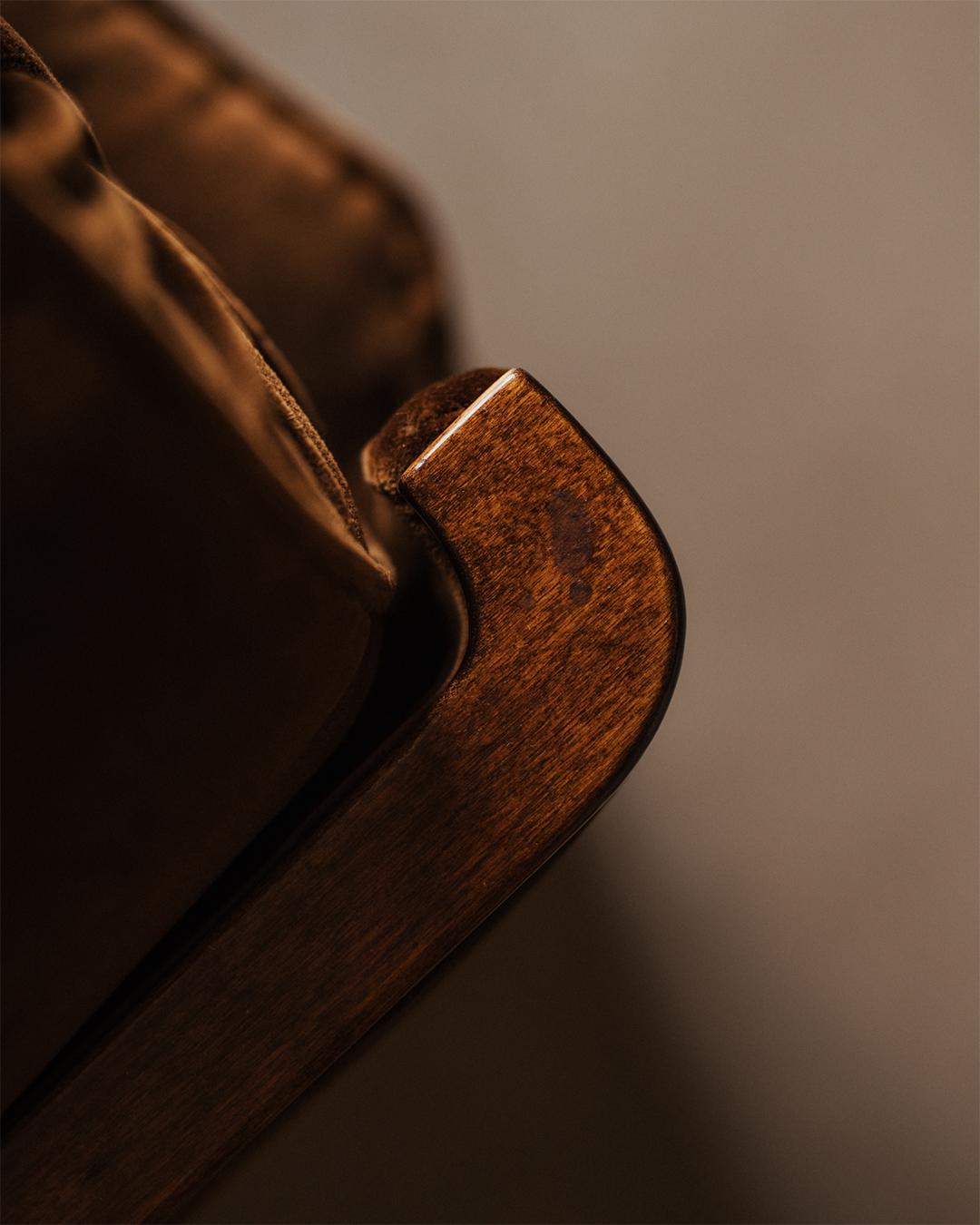 Scandinavian Art Deco daybed from the 1930s. Reupholstered in Belgium by hand in a brown Dedar cotton velvet. Comes with a loose mattress, roll cushion, and decorative pillow in a faux-leopard hide. The seat is constructed on a spring-supported