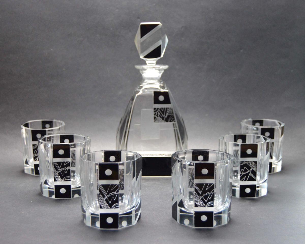 This decanter and glasses by Karl Palda are one of the nicest we have ever offered. All of the designs by this forward-thinking artist from the deco era in Czechoslovakia are quite wonderful but what sets this apart is the size of the glasses which