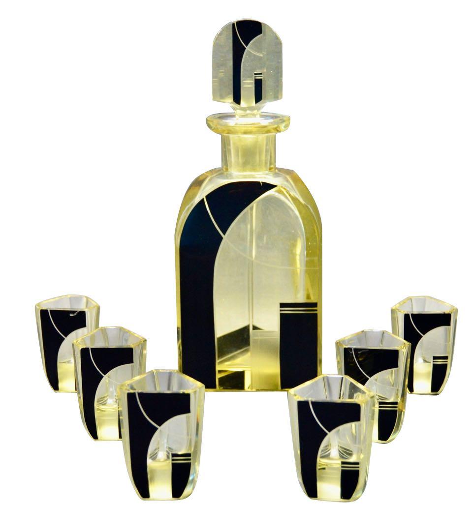 This decanter and glasses by Karl Palda are extremely unusual and interesting. All of the designs by this forward-thinking artist from the deco era in Czechoslovakia are quite wonderful but what sets this apart is the size of the glasses are nice,