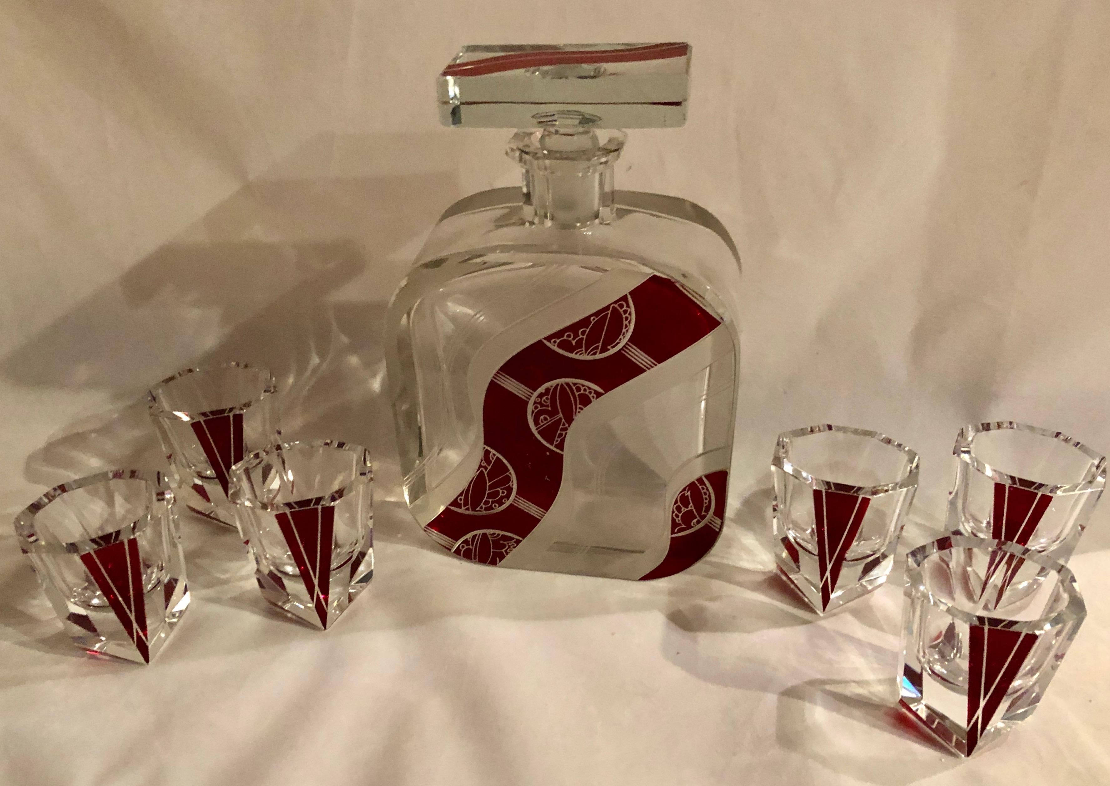 A beautiful Bohemian Art Deco cut crystal decanter that is “wheel carved” and enameled. This set is attributed to the master of this era of design

From the early 1930s, Karl Palda. It’s a nice interplay between the the deep “V” chevron shaped