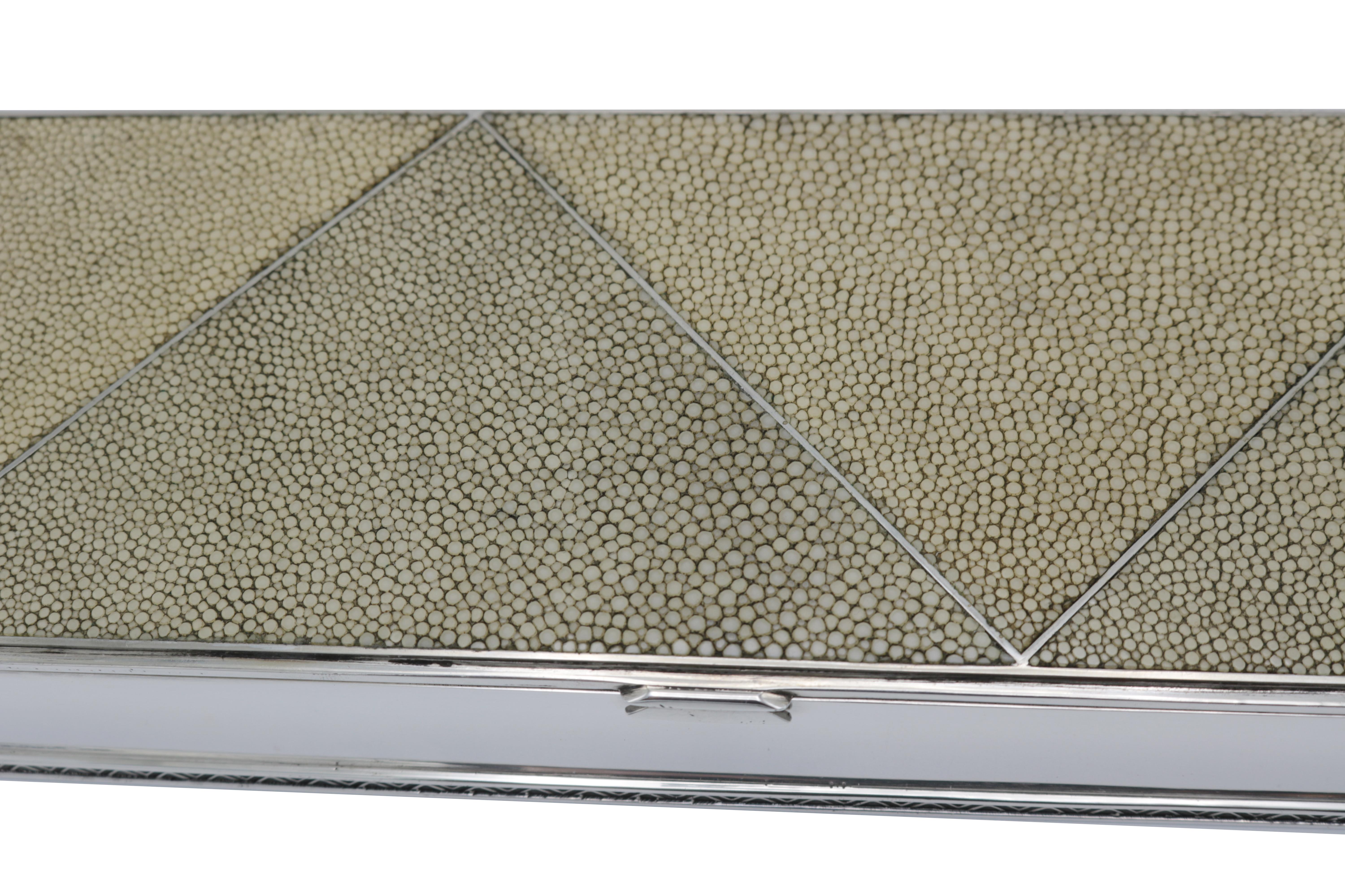 An Art Deco decorative silver box. 
Sterling silver and shagreen.
Marked Sterling on bottom.