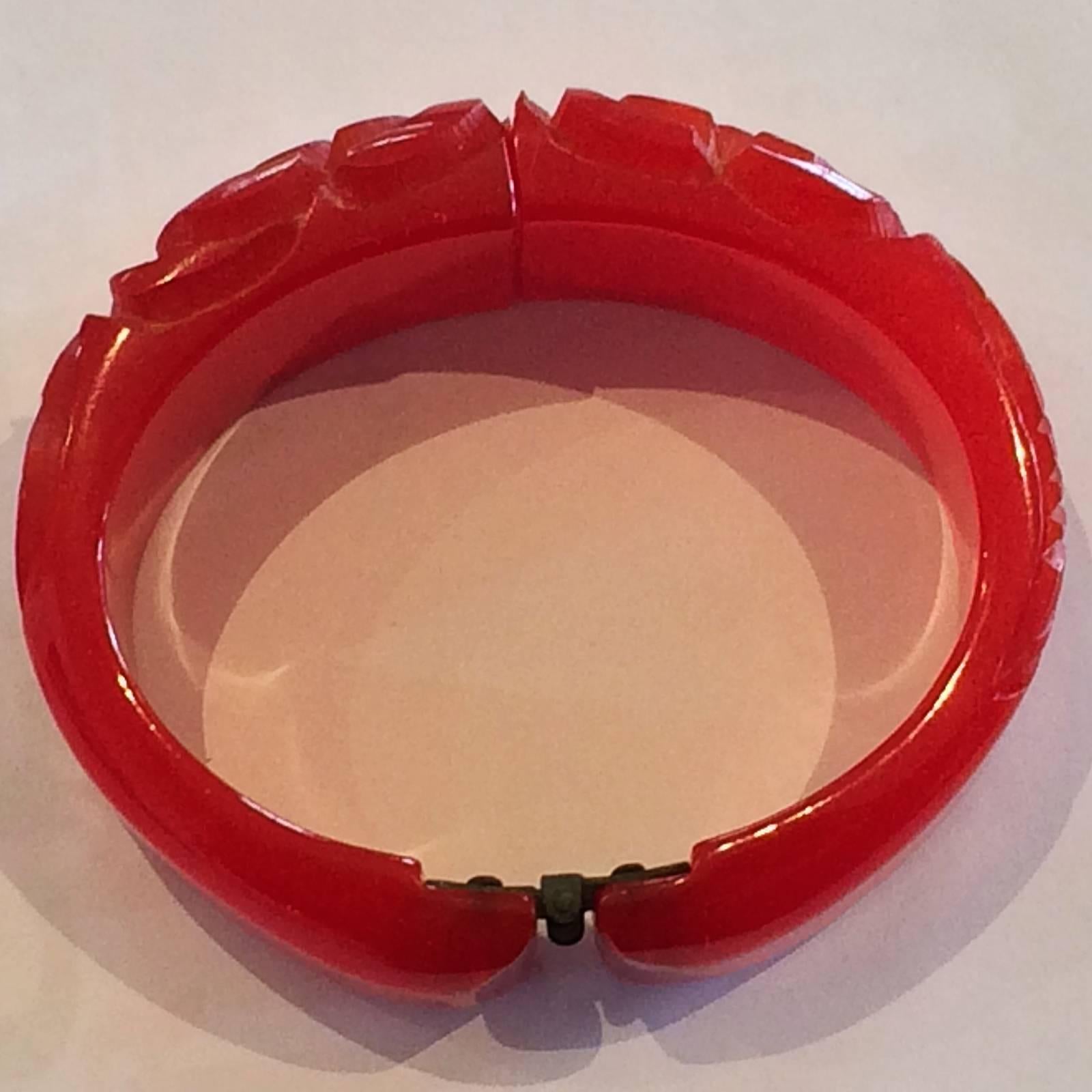 Women's Art Deco deeply Carved Bakelite Hinged Clamper Bangle in brilliant Ruby red  For Sale