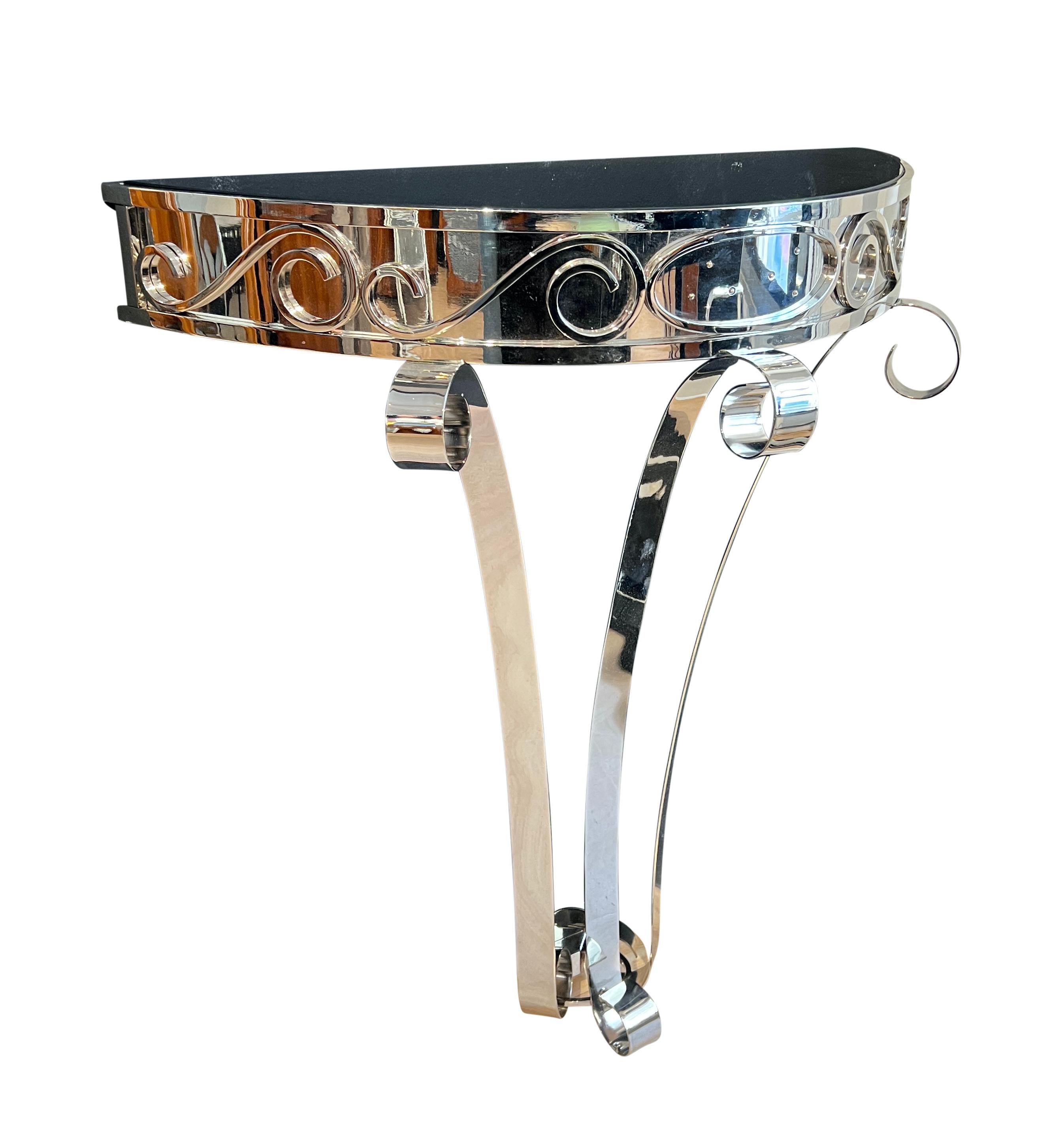 Beautiful Art Deco Demi-lune Console Table, Nickel-Plated Metal, France circa 1930
Metal frame, newly nickel-plated and polished. Top with black lacquered glass plate (newly made, originals still available).
Dimensions: H 86cm x W 75cm x D 35cm