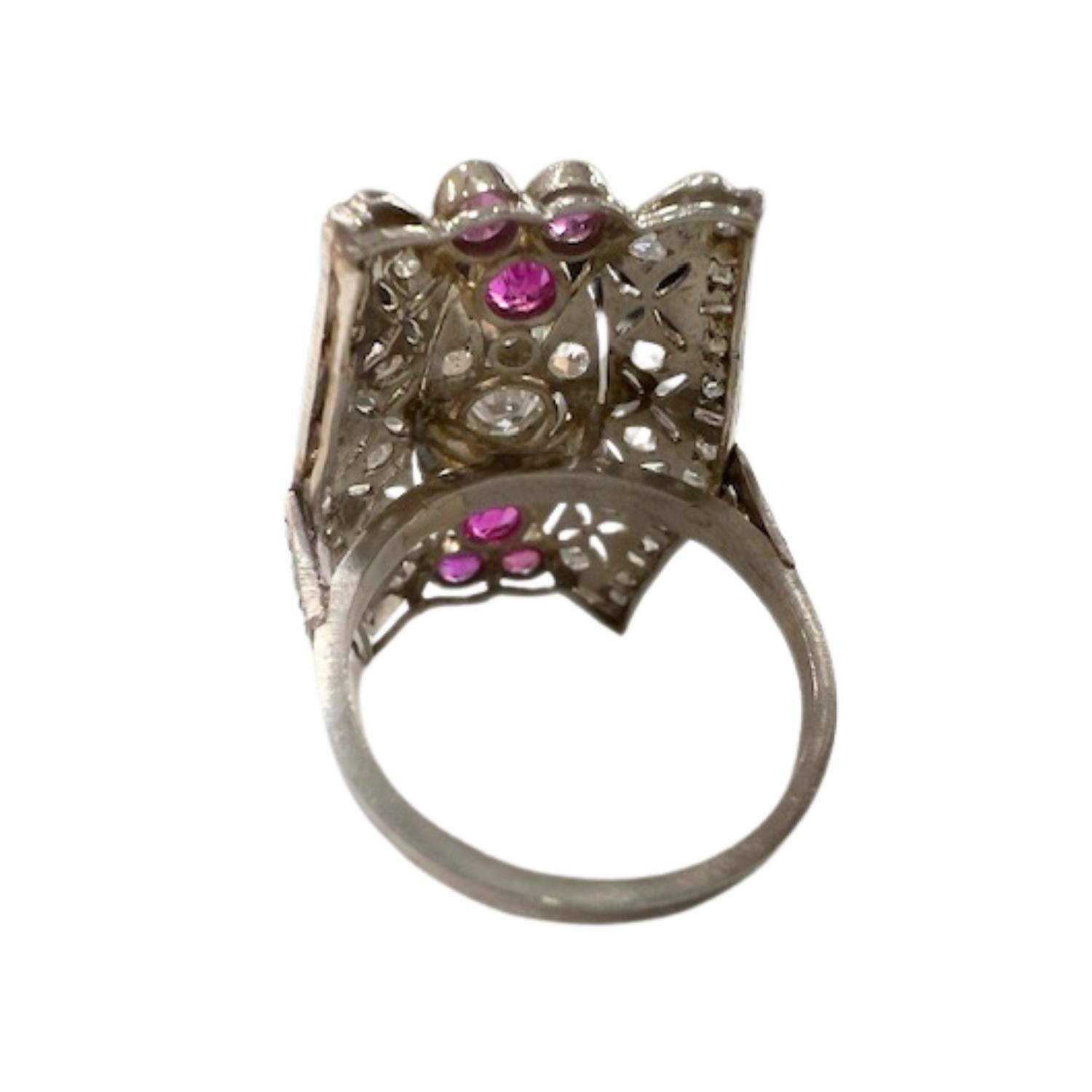 A beautiful Art Deco-inspired ring crafted in 18k gold, featuring antique-cut diamonds and vibrant rubies, offering a perfect blend of vintage elegance and modern luxury.

**IN STOCK**

Technical Specifications:

Metal: 18k Gold
Weight: 8.42