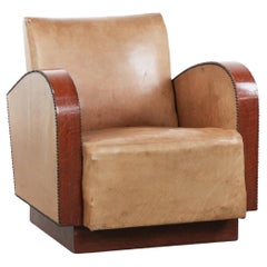 Art Deco design armchair made of cowhide leather in light cognac colour
