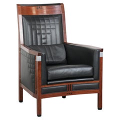 Art Deco design armchair with black leather with decorative stitching