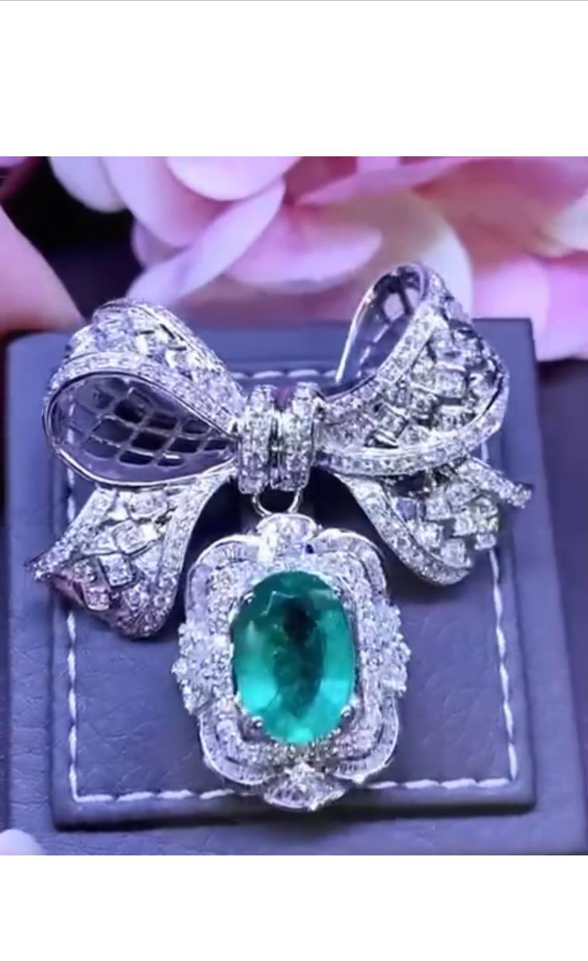An exquisite pendant/brooch in Art Deco design in 18k gold with a Zambia emerald oval cut of 5,88 carats and diamonds of 3,43 carats F/VS.
So original and chic style by Italian designer.
Handcrafted by artisan goldsmith.
Excellent manufacture and