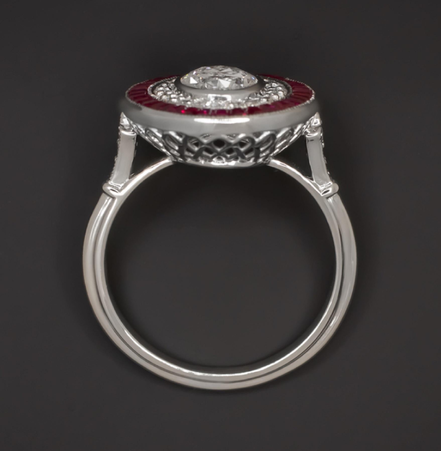 An important ring boasts a one carat perfectly white oval diamond surrounded by a double halo of sparkling diamonds and custom cut rich red rubies. 

The red of the natural rubies creates an eye-catching contrast with the bright white of the