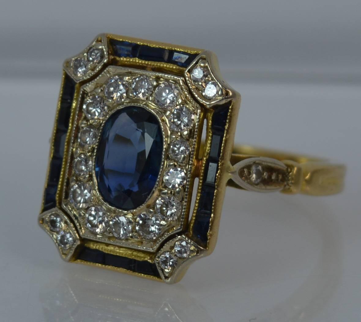 
A fantastic Sapphire and Diamond panel cluster ring of art deco design.

Solid 18 carat yellow gold piece with a white gold setting for the diamonds.

​The emerald shaped head measures 12mm x 15mm.

​The oval cut sapphire to the centre measures