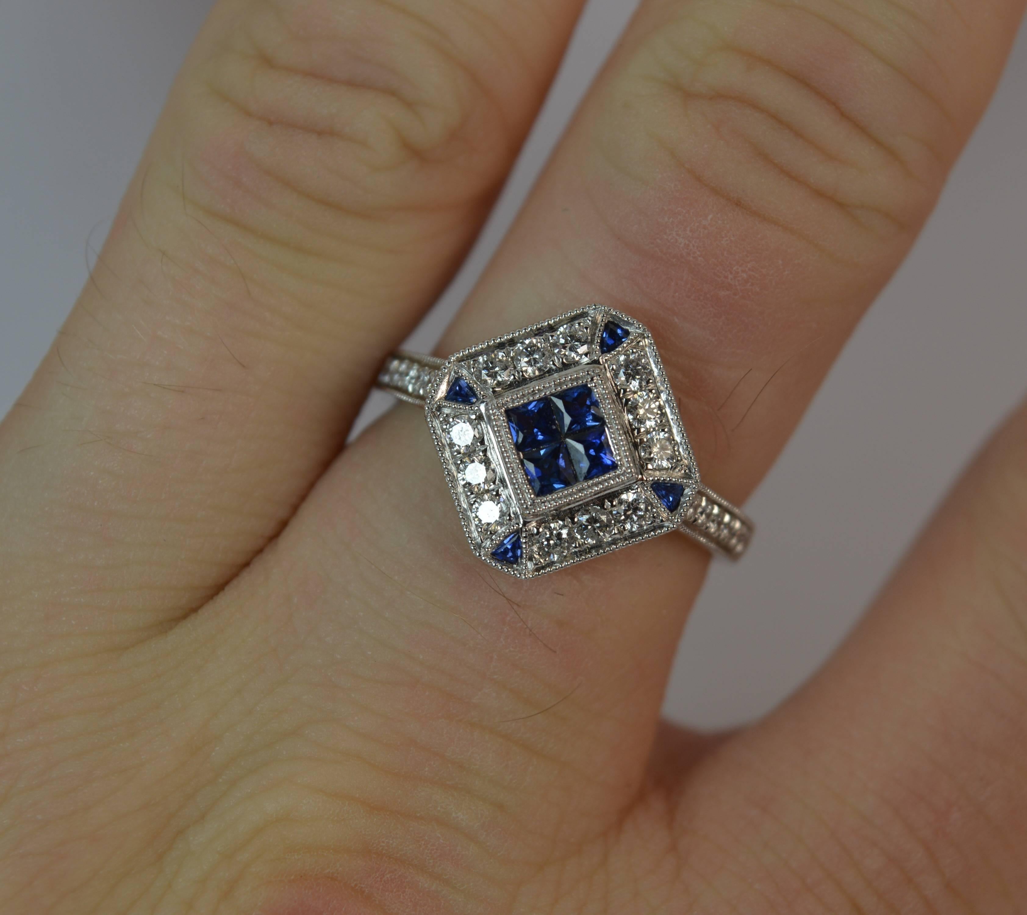 
A fantastic Sapphire and Diamond cluster ring.

Solid 18 carat white gold piece.

​Designed with four princess cut Ceylon sapphries to the centre with twelve round brilliant cut diamonds surrounding, VS clarity with a triangular cut sapphire to