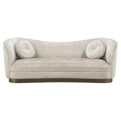Art Deco Design Style Beige Fabric And Bronze Base Curved Sofa