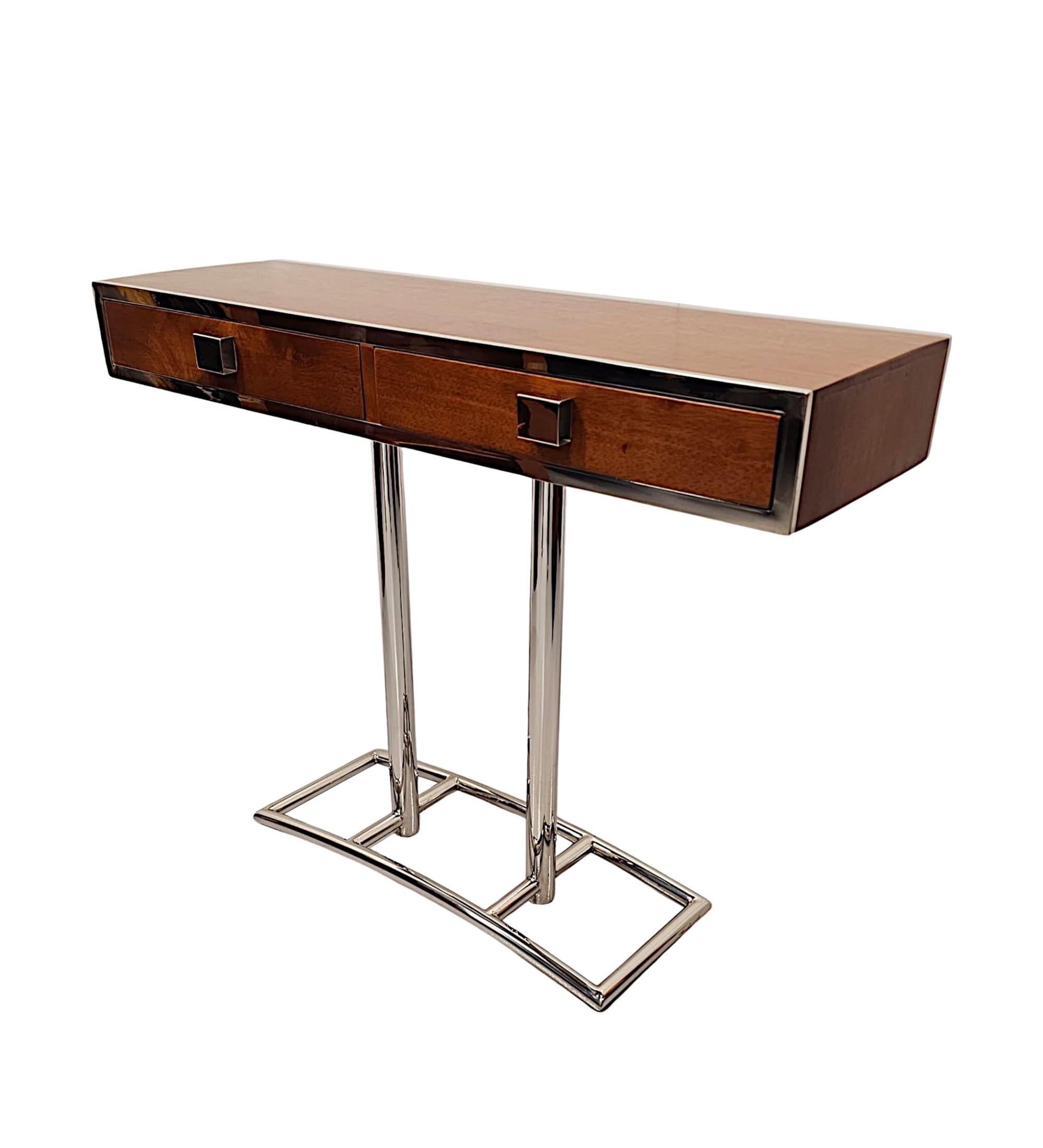 A fabulous contemporary hand made Art Deco design richly patinated walnut console table of exceptional quality, finely carved and with a stunningly clean simple design, framed throughout with gorgeous chrome border detail.  The well figured moulded