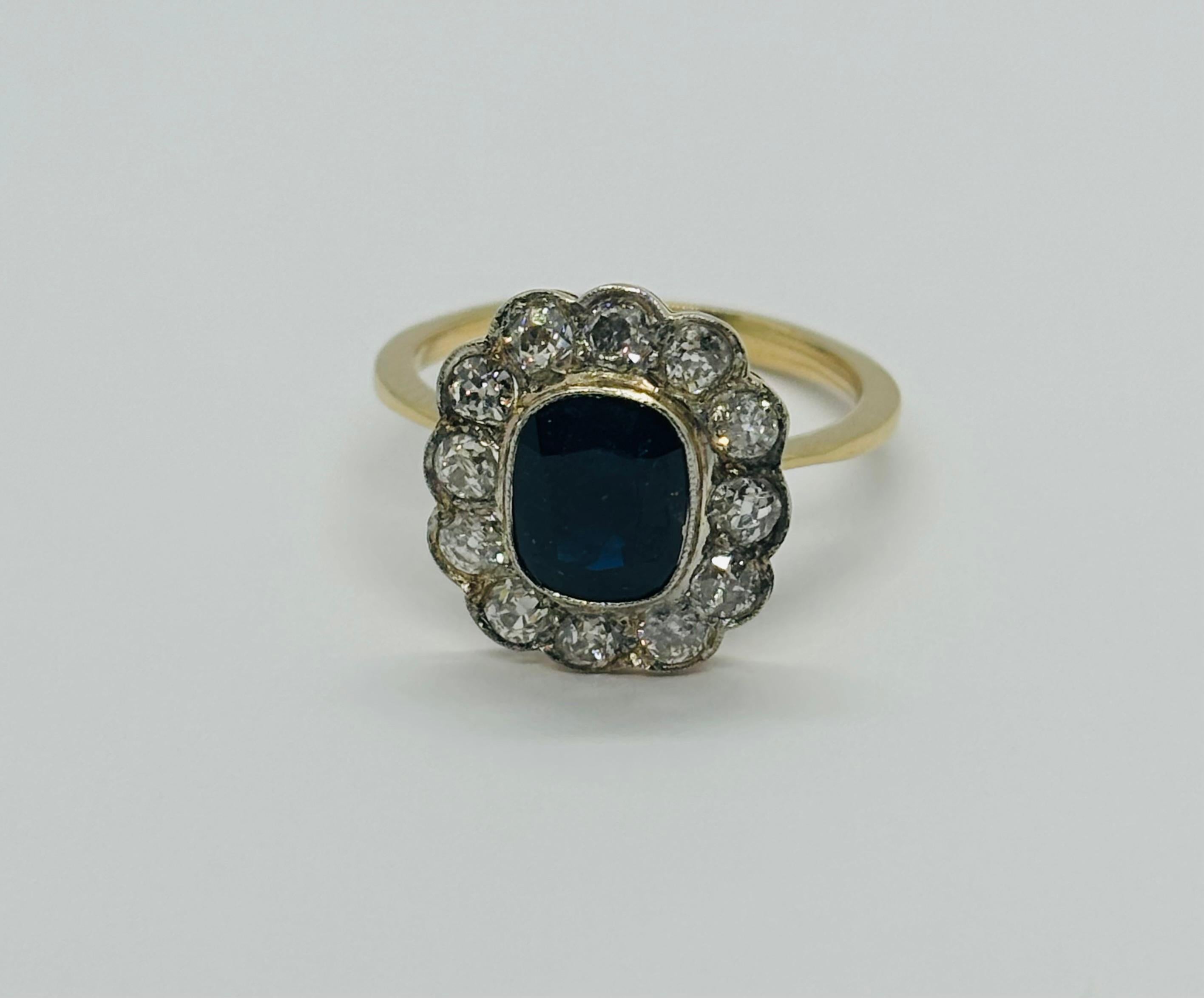 A stunning Art Deco-inspired ring featuring a central Australian sapphire and antique-cut diamonds, set in 18k gold with platinum accents.

**IN STOCK**

Technical Specifications:

Metal: 18k Gold & Platinum
Weight: 3.6 grams
Gemstones:
1 central