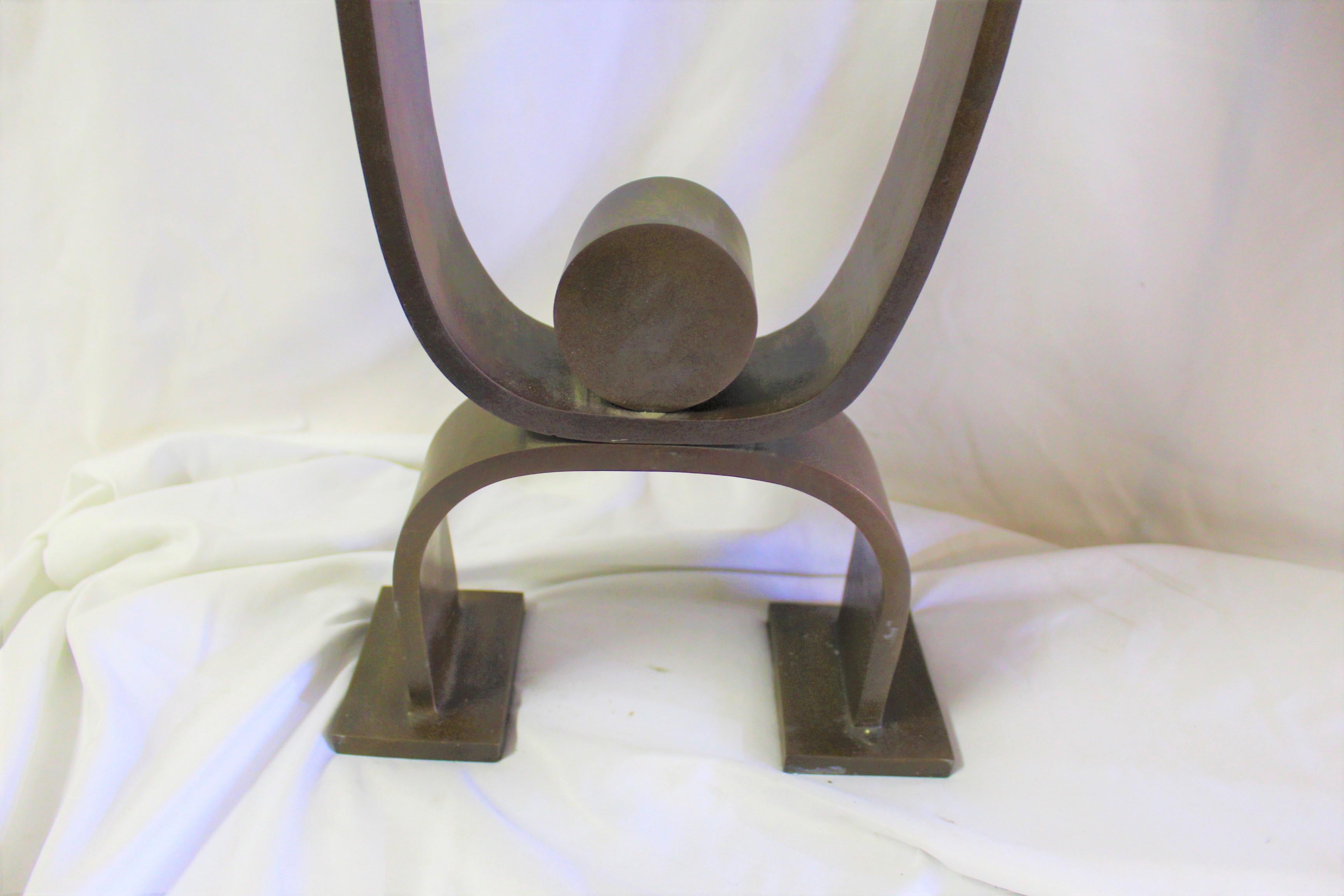 A good Deco looking Andiron after the design of Donald Deskey. Heavy steel with bronze patina finish. Custom made (sample) for a Lighting Showroom. Height is at 22