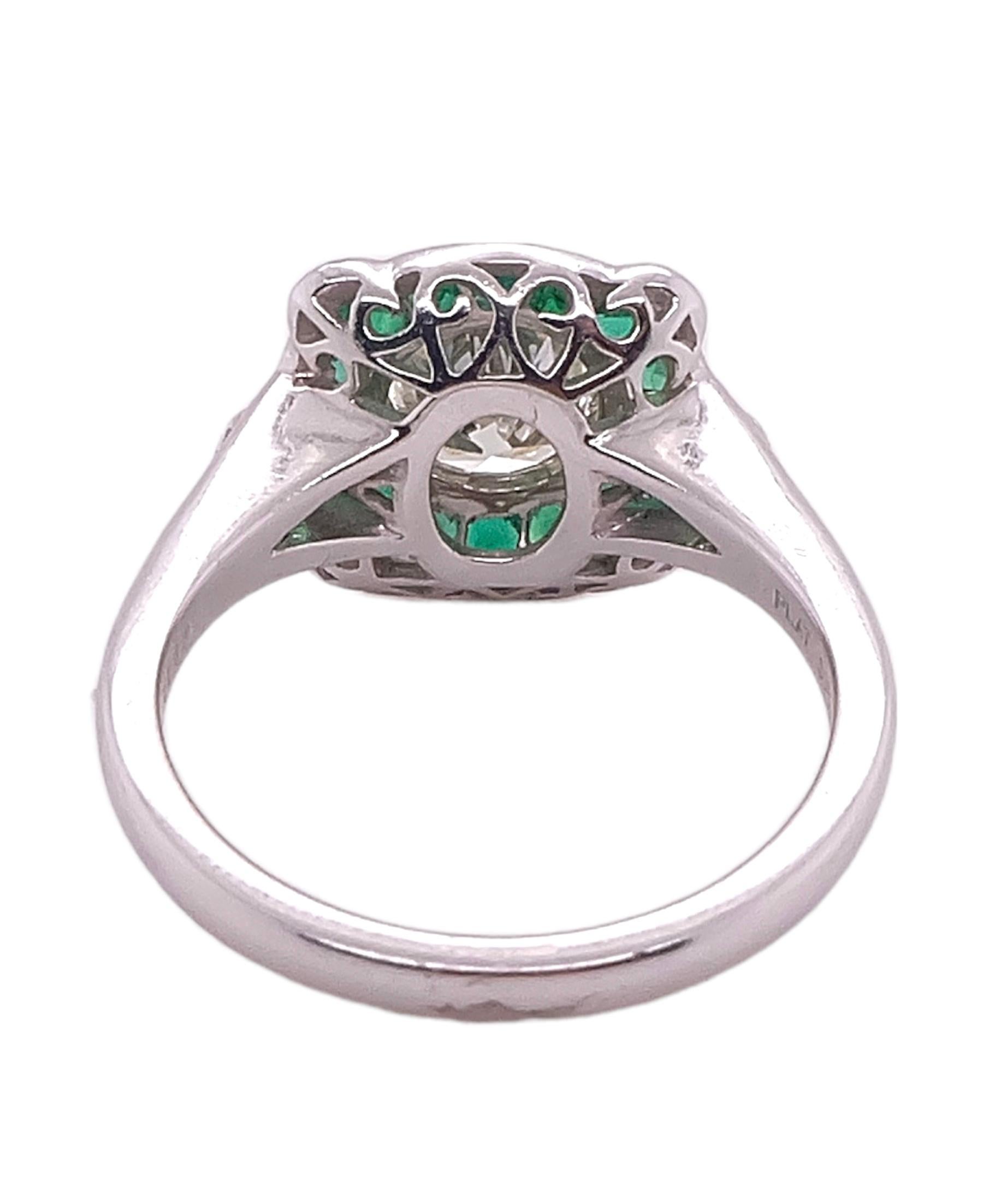 Beautifully designed Art Deco Emerald and Diamond Platinum Ring by Sophia D with 0.81 round cut diamond ring, 0.14 carats of small diamonds and 0.88 carats of emeralds. Ring is available for resizing.
