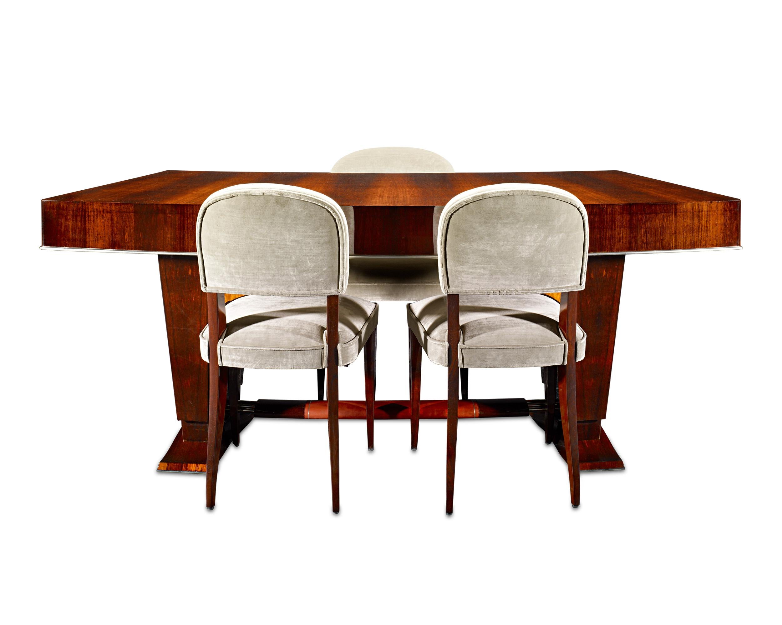 This timeless chair and desk set features the iconic designs of two French Art Deco greats, Jules Leleu and Maxime Old. Together, the chic set epitomizes the fluid elegance of this period’s best furniture suites. The three chairs by Jules Leleu are