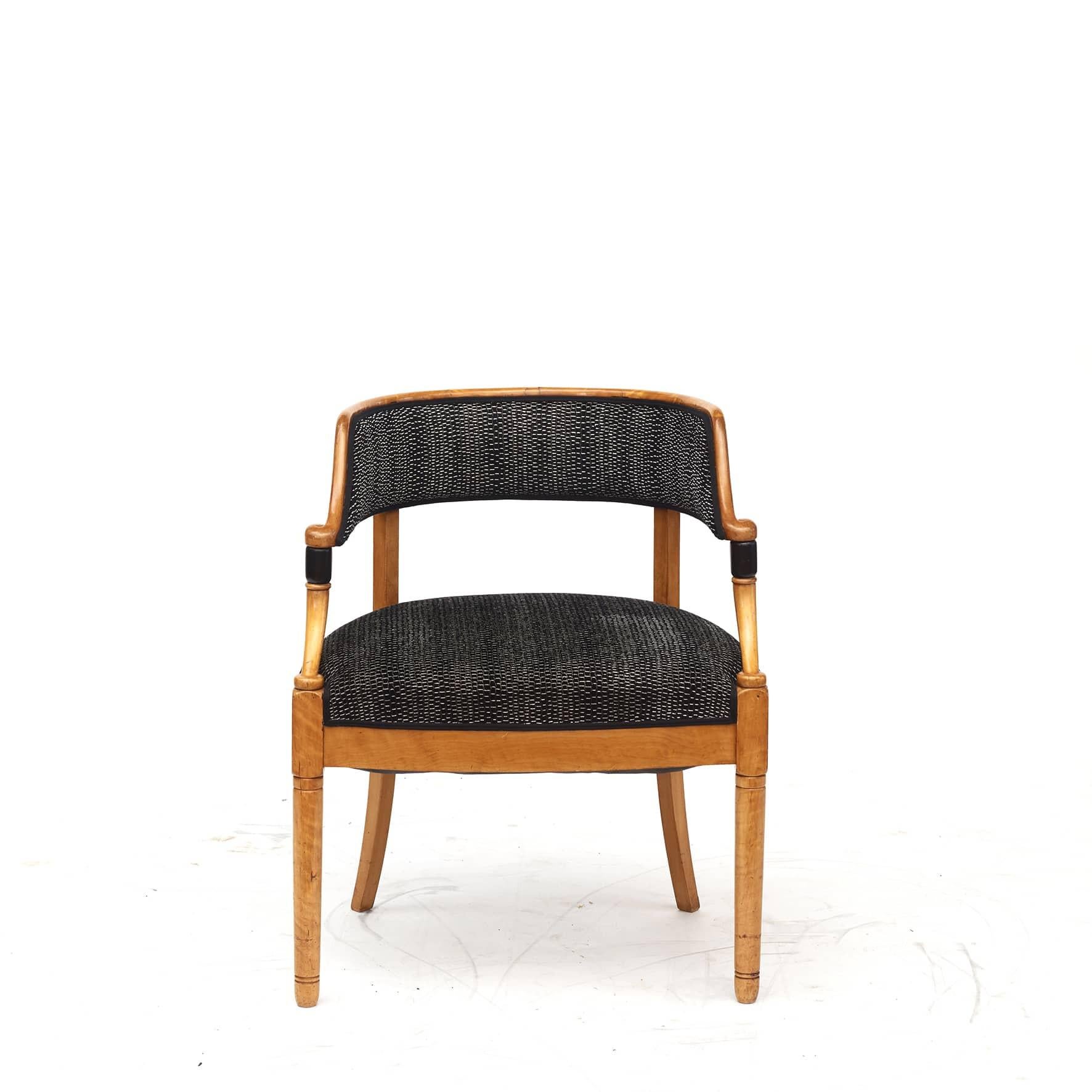 Art Deco desk armchair made of birch wood and details in black polished birch.
Newly upholstered textile with pebble velour from Larsen.

Denmark ca. 1920.
 