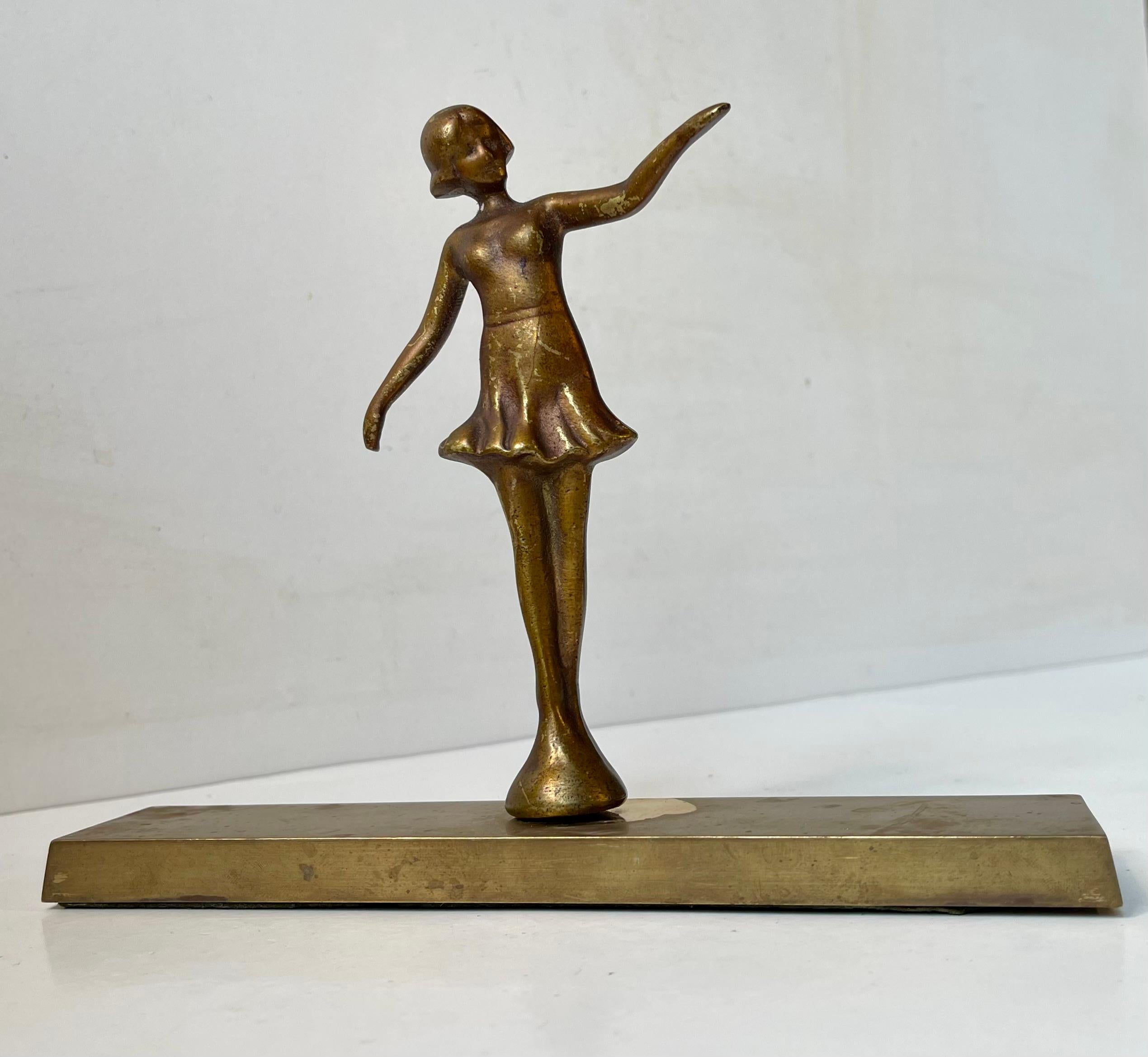 A small desk sculpture or paperweight executed in patinated bronze. Given as a 40 year anniversary gift in 1949 (dated 1909-49). Danish made. Measurements: H: 16 cm, base: 19.5x4 cm.