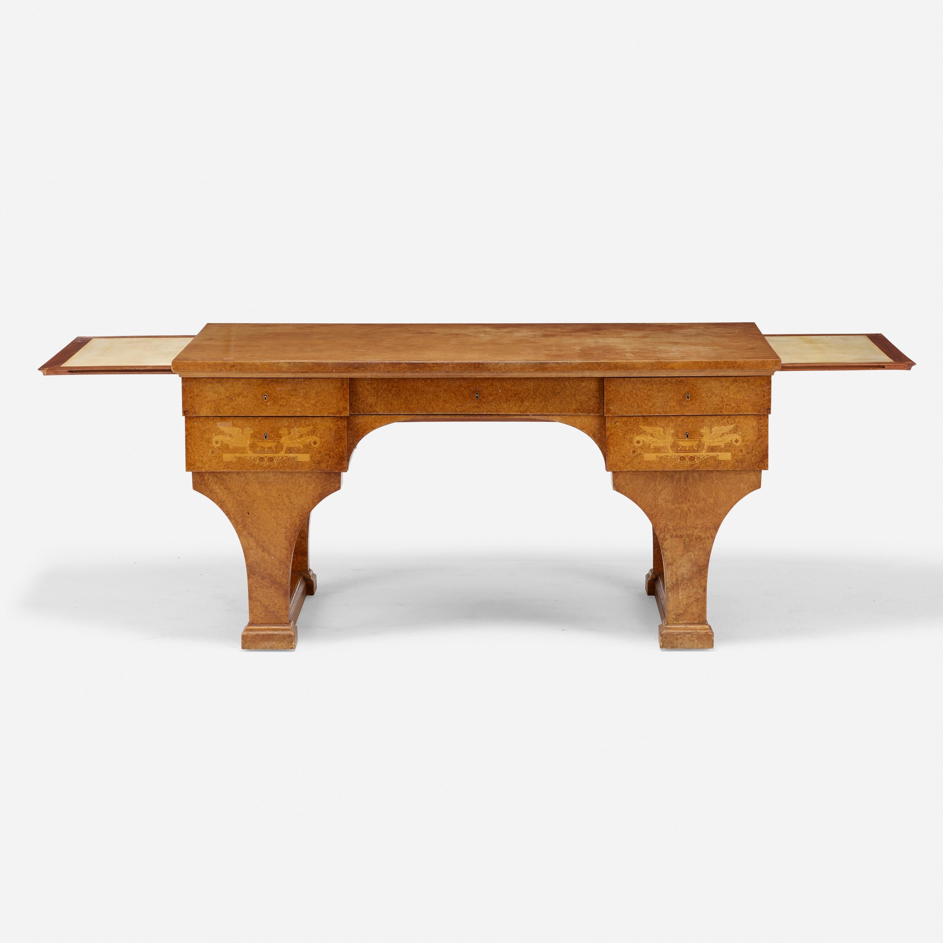 This Boiceau desk bears his stamp, and was entirely veneered in amboyna, an exotic burlwood named for Ambon, the Indonesian island where it was harvested. The naturally squiggling patterning of the veneer provides an overall surface decoration. The