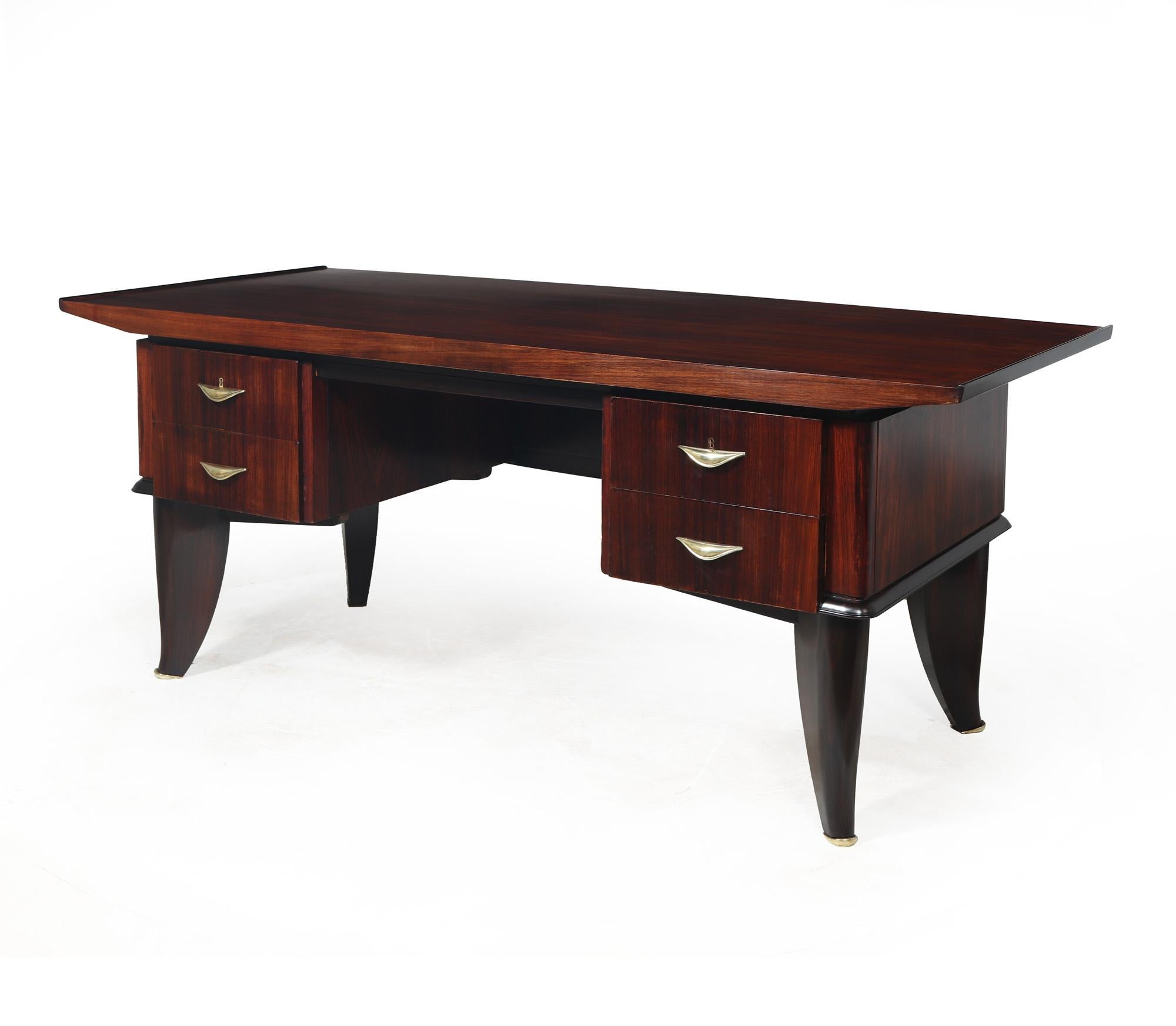 ART DECO DESK
A stunning French Art Deco desk produced in Paris in 1930 by Sanyas et Popot ,this example has been crafted from oak and rosewood designed with a curved top section. It has four lockable drawers, all adorned with art deco bronze