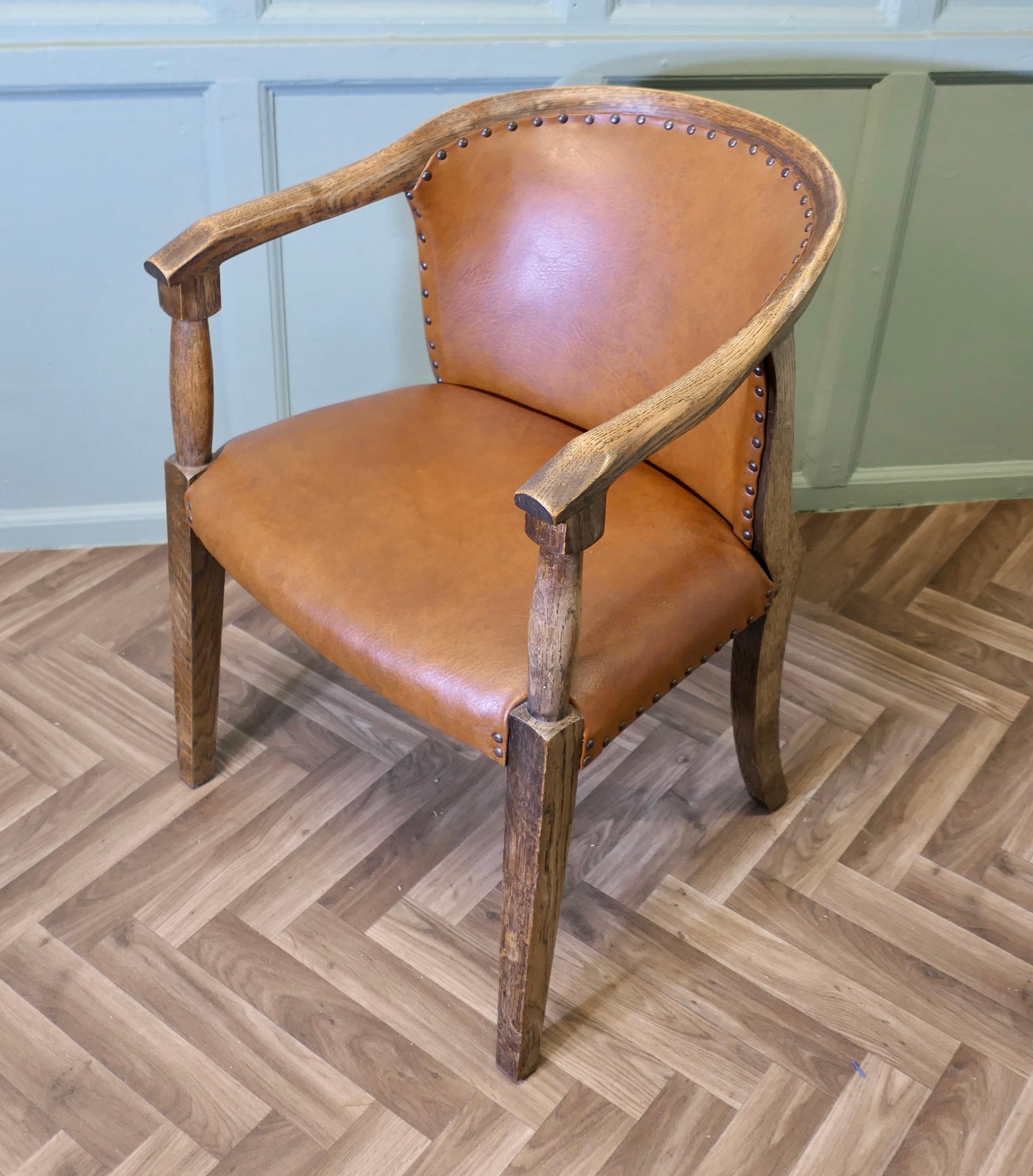 Art Deco Desk Chair, Board Room or Office Chair
 
The Chair is comfortable and stylish, it has a curved back and is made in Oak and Tan Leather Hide. The chair and its studded leather upholstery are in good condition
it is 31” high and 22” across