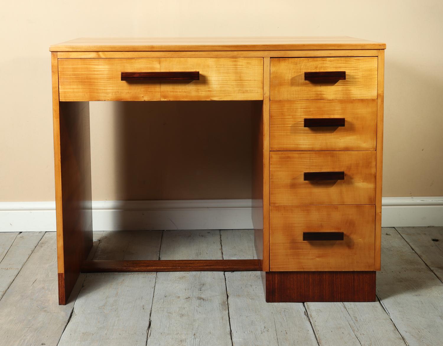 Art Deco desk in sycamore circa 1930
A Very good quality Art Deco desk produced in England in the 1930s in sycamore and rosewood, it has five drawers with dovetail joint construction the desk is in excellent condition throughout and has been fully