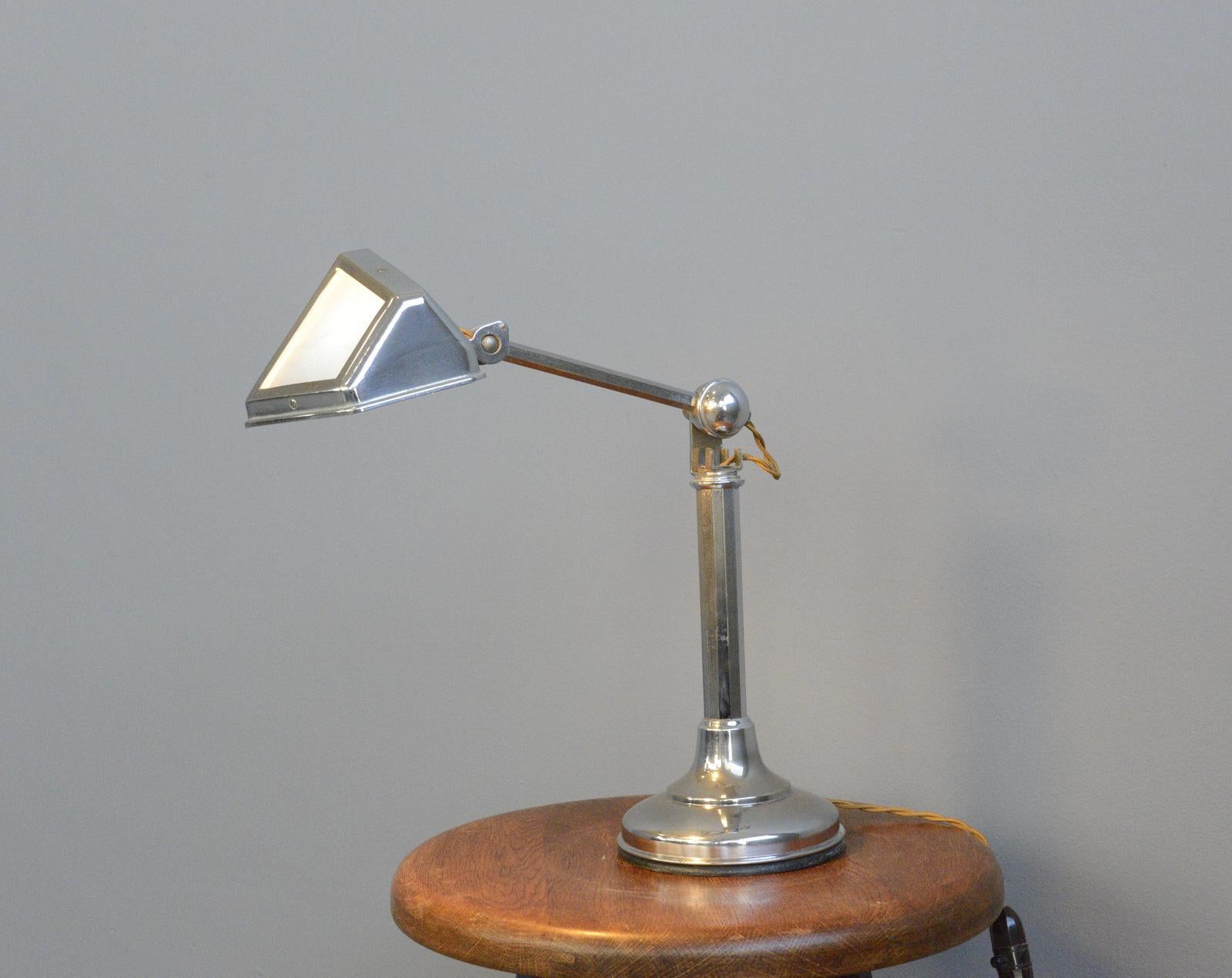Art Deco desk lamp by Pirouette, circa 1930.

- Chrome base and arm
- Original Art Deco Bakelite on/off switch
- Takes E14 fitting bulbs
- Opaline glass diffuser
- French, circa 1930
- Measures: 30 cm wide x 16 cm deep x 46 cm