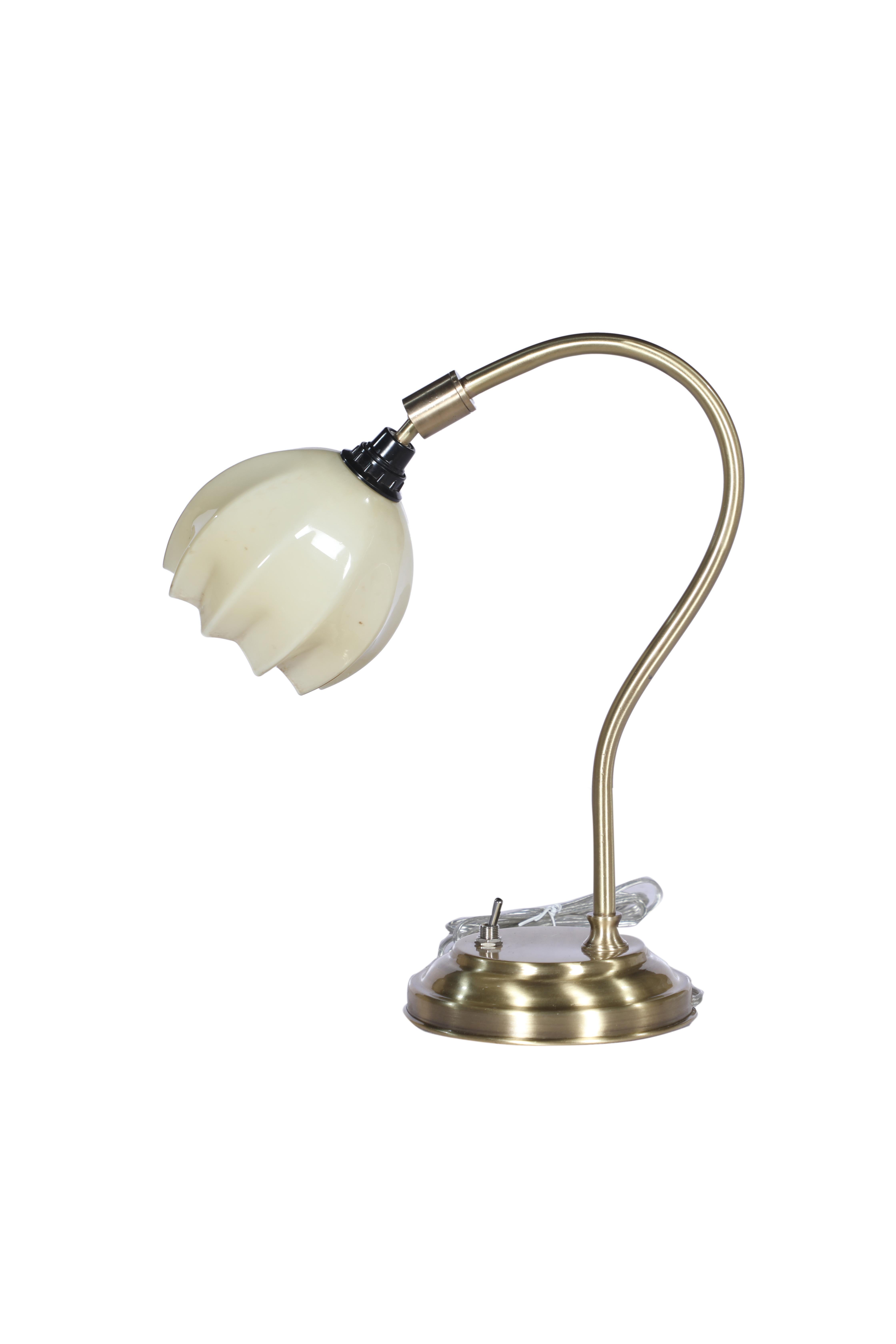 An Art Deco period table or desk light with an adjustable art glass shade in a flower motif. The shade itself is 5