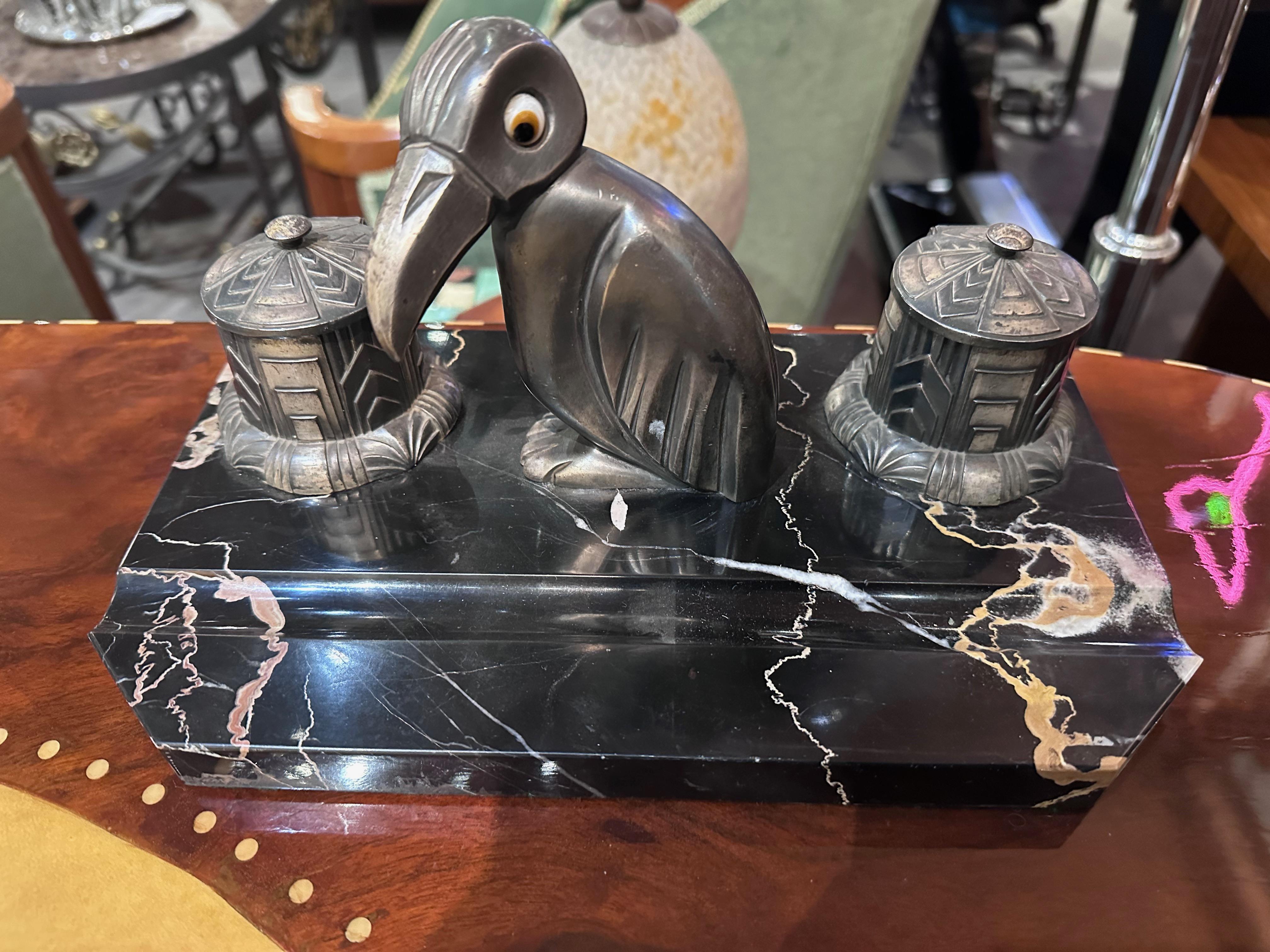 Art Deco Desk Set is a captivating blend of timeless elegance and functional design. The centerpiece of this ensemble is the charming Penguin Statue, reminiscent of the iconic designs by H. Moreau from the glamorous 1930s era. He is known for his