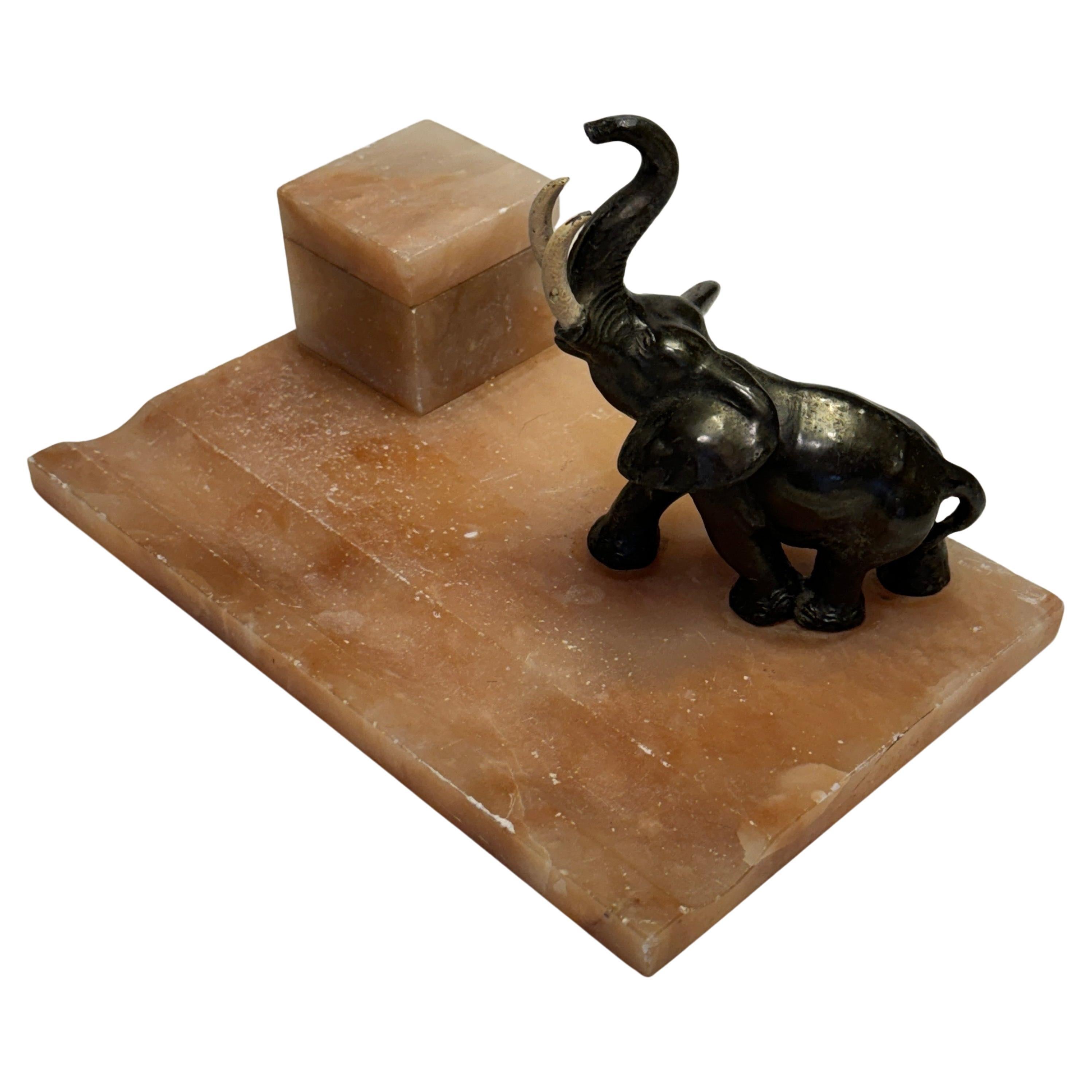Beautifull Art Deco desk set in Alabaster and Bronze with large decorative Elephant, inkwell and carved area as penholder. This is a wonderful piece for a collector of these pieces.