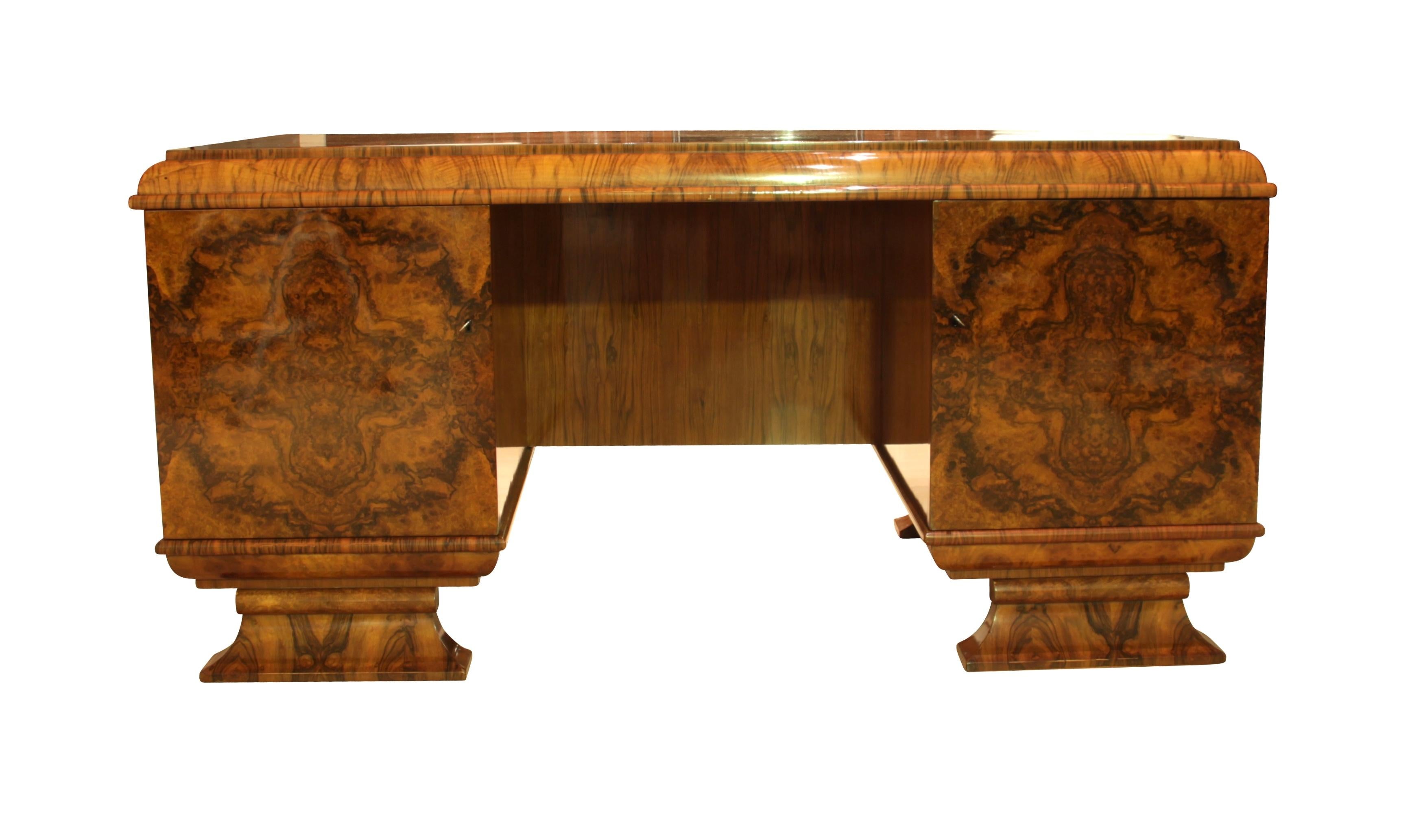 Beautiful Vintage Art Deco Desk, fully restored in polished Walnut from Germany around 1920.

Wonderfully selected book-matched walnut veneer and solid wood, all hand-polished with shellac (French Polished). Noteworthy are also the beautiful