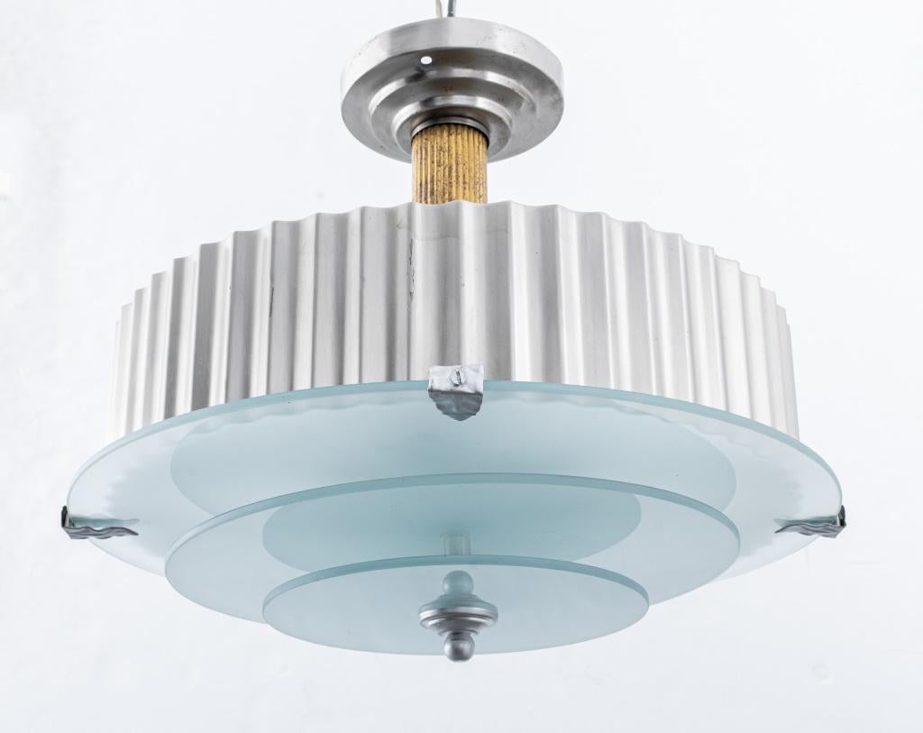 Art Deco chandelier pendant with fluted chromed body and stacked opaque glass discs, in the taste of Donald Deskey (American, 1894-1989). 17