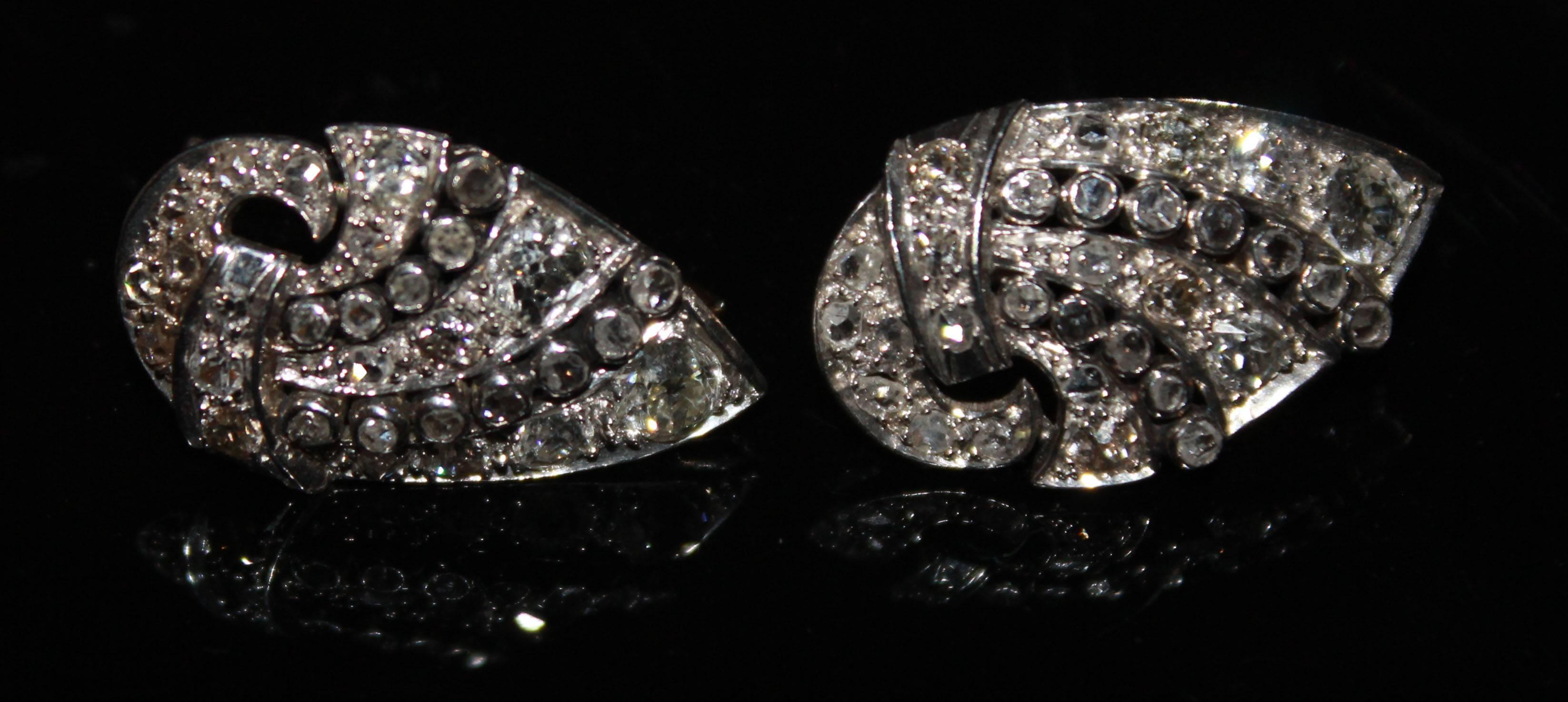 Art Deco Diamond & Platinum Earrings
Set with rose cut, single cut & old cut diamonds (approx 2.25cts),
both claw & collet set.
Unmarked but tests as platinum, with French safety fittings for pierced ears.
Excellent codition & boxed. 