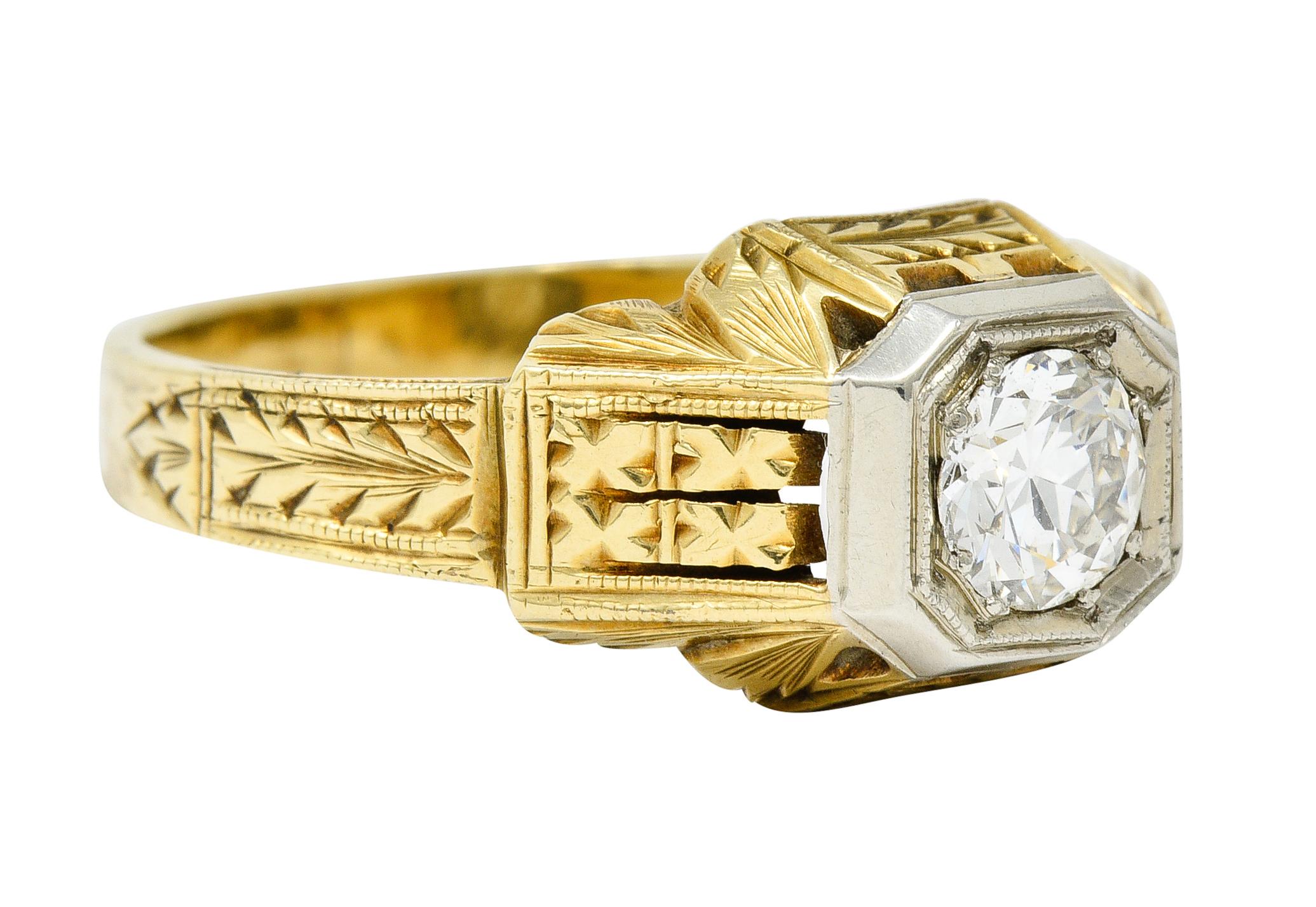 Centering a transitional cut diamond weighing approximately 0.58 carat; J/K color with VS1 clarity

Set low in a white gold square form head accented by milgrain

Yellow gold mounting is deeply engraved throughout with stylized florals and