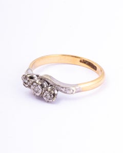 Art Deco Diamond, 9 Carat Gold and Platinum Cross Over Three-Stone Ring