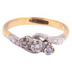 Art Deco Diamond, 9 Carat Gold and Platinum Cross Over Three-Stone Ring