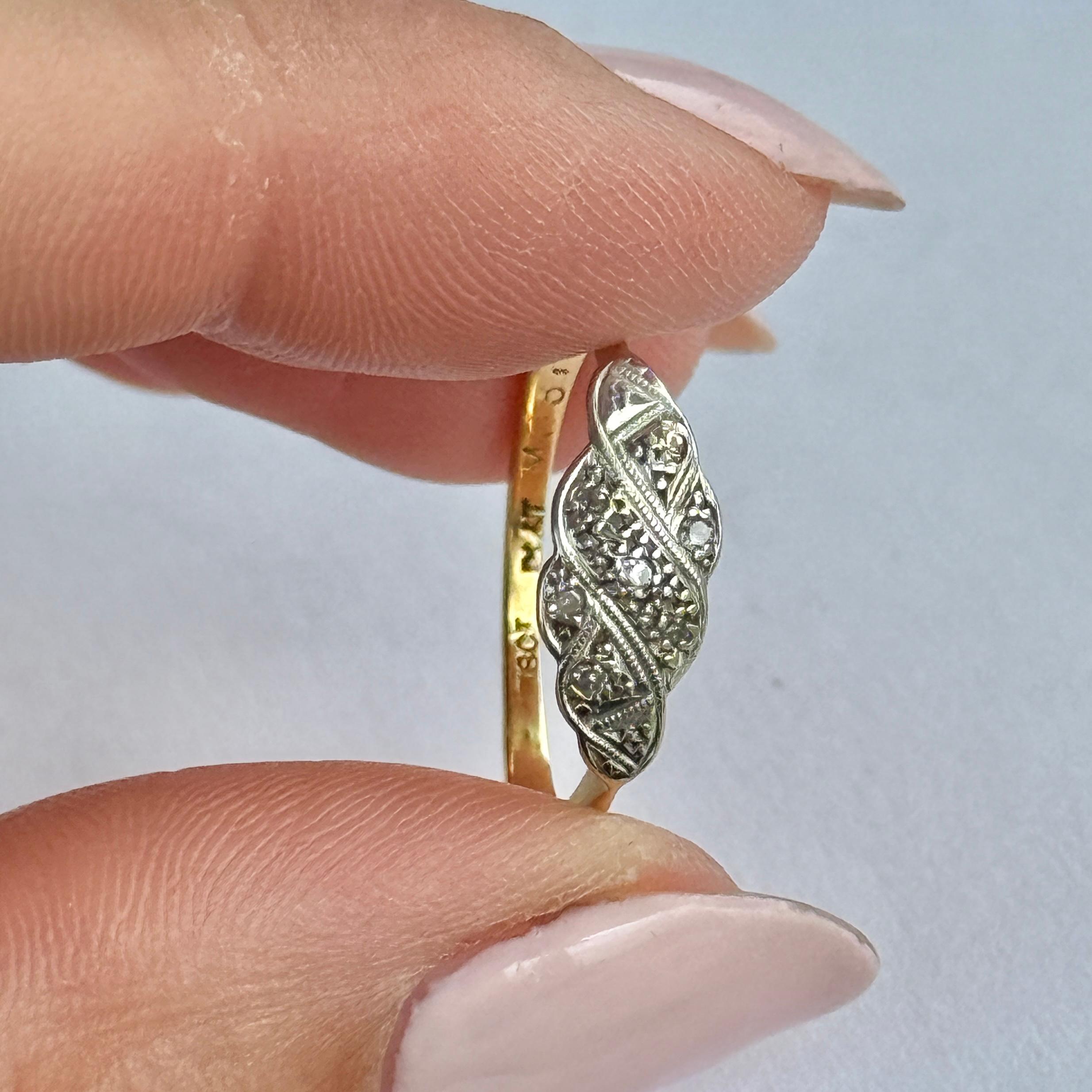 What a stunning ring this is. Encrusted with diamonds, this ring has a lovely sparkle. There are 7 diamonds which total 14pts. The stones are set in platinum. 

Ring Size: N or 6 3/4 
Panel Dimensions: 15x6.5mm

Weight: 2g