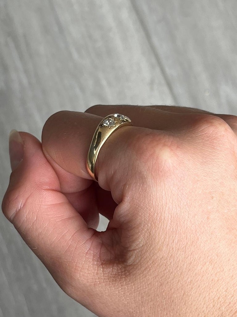 This gorgeous 18ct gold band holds three diamonds totalling 80pts. They are bright and have a lovely sparkle and are set in star settings.  

Ring Size: S or 9
Band Width: 6.5mm 

Weight: 4.7g